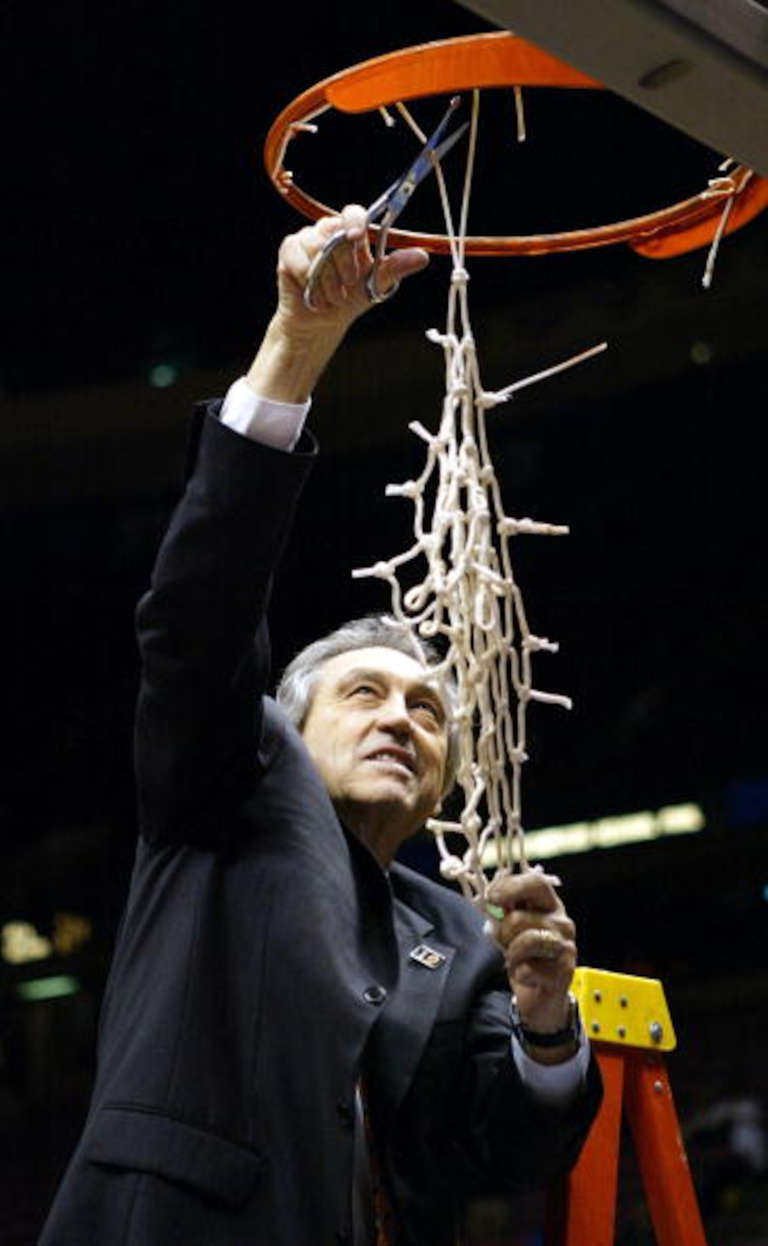 EAST RUTHERFORD, NJ - MARCH 27:  Head coach Eddie Sutton of the Oklahoma State Cowboys celebrates by cutting down the net after defeating the St. Joseph's Hawks 64-62 during their fourth round regional game of the NCAA Division I Men's Basketball Tourname