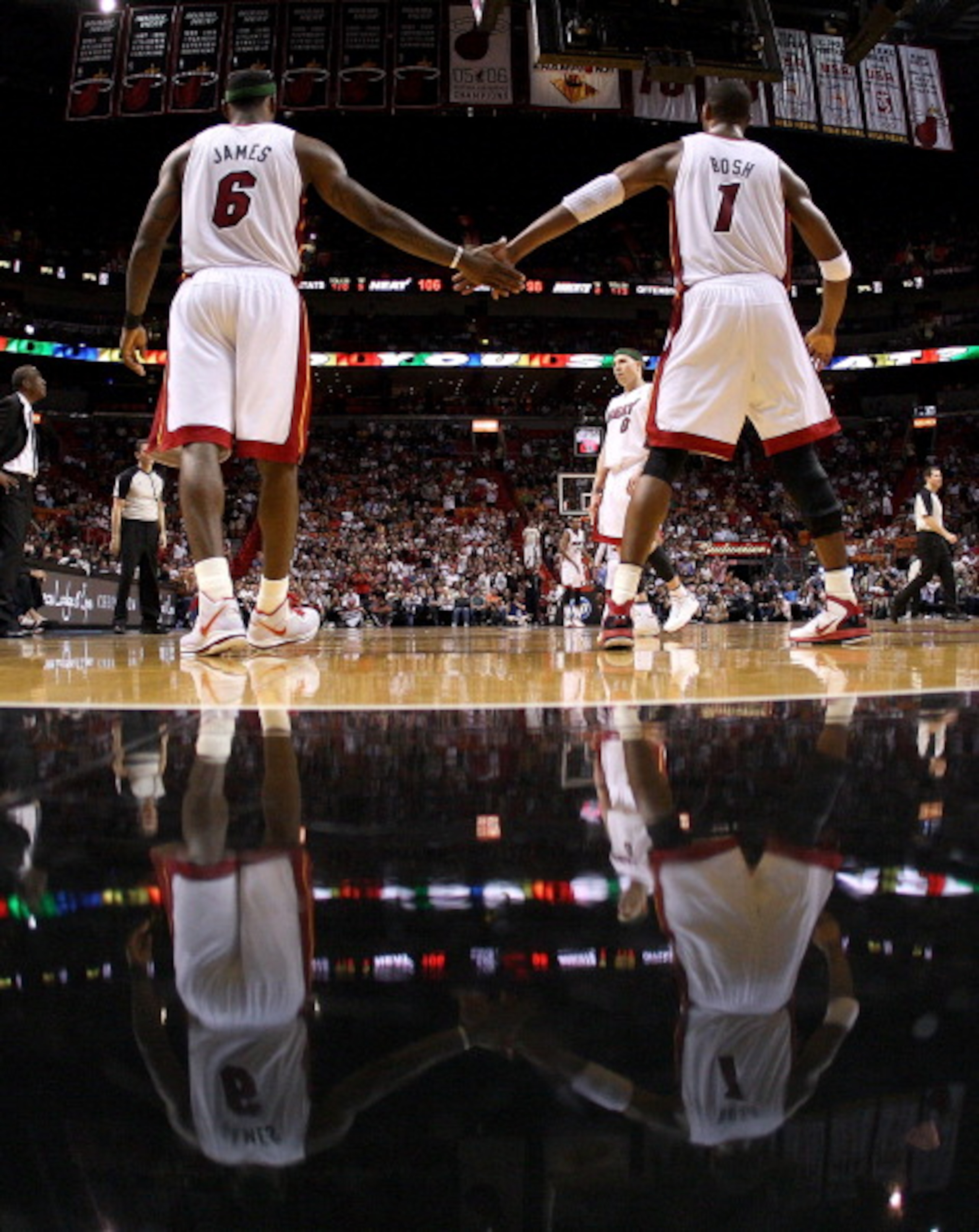 MIAMI, FL - APRIL 08: LeBron James #6 of the Miami Heat is congratulated by Chris Bosh #1 during a game against the Charlotte Bobcats at American Airlines Arena on April 8, 2011 in Miami, Florida. NOTE TO USER: User expressly acknowledges and agrees that, MIAMI, FL - APRIL 08: LeBron James #6 of the Miami Heat is congratulated by Chris Bosh #1 during a game against the Charlotte Bobcats at American Airlines Arena on April 8, 2011 in Miami, Florida. NOTE TO USER: User expressly acknowledges and agrees that,