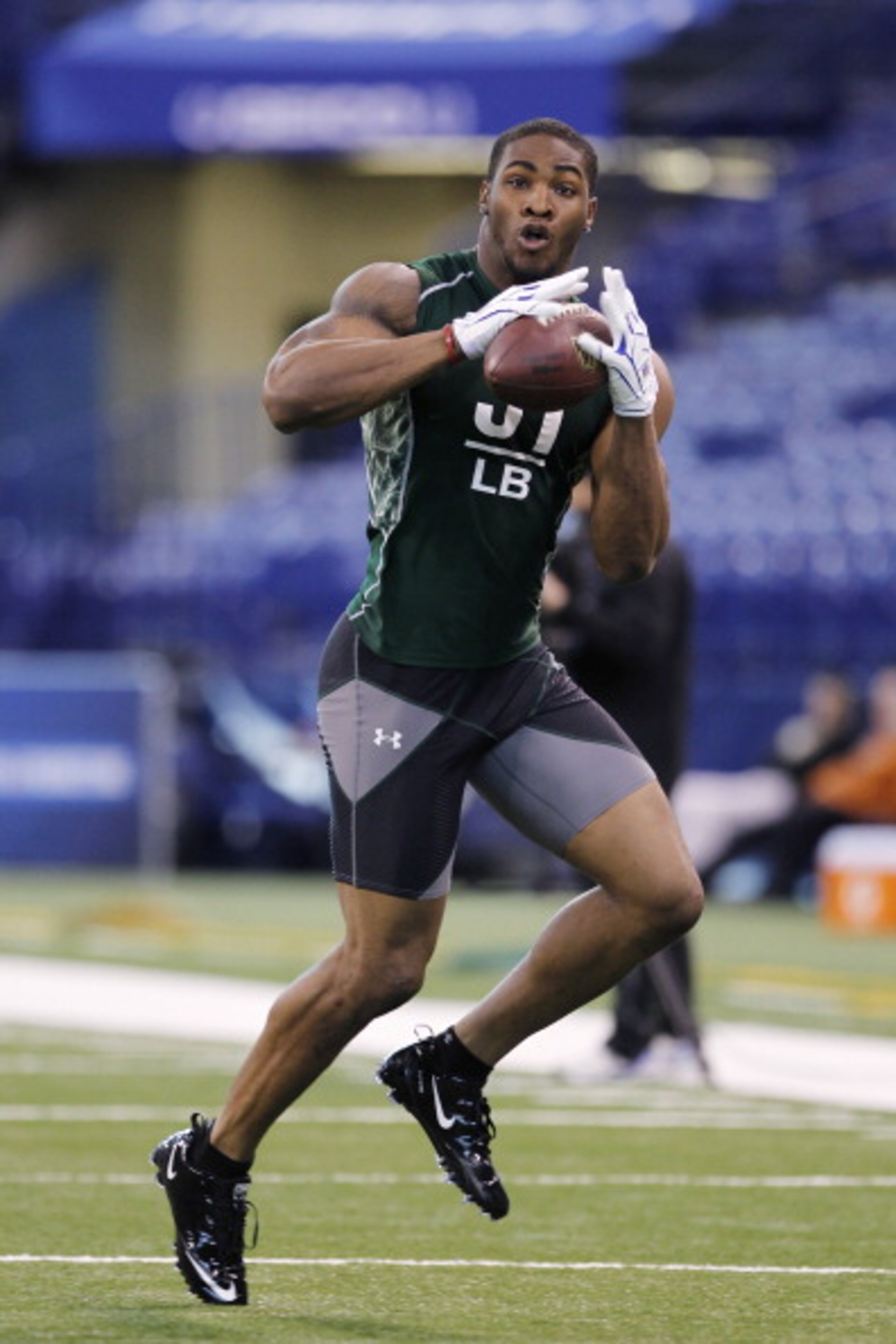 INDIANAPOLIS, IN - FEBRUARY 28: Martez Wilson of Illinois works out during the 2011 NFL Scouting Combine at Lucas Oil Stadium on February 28, 2011 in Indianapolis, Indiana. (Photo by Joe Robbins/Getty Images)