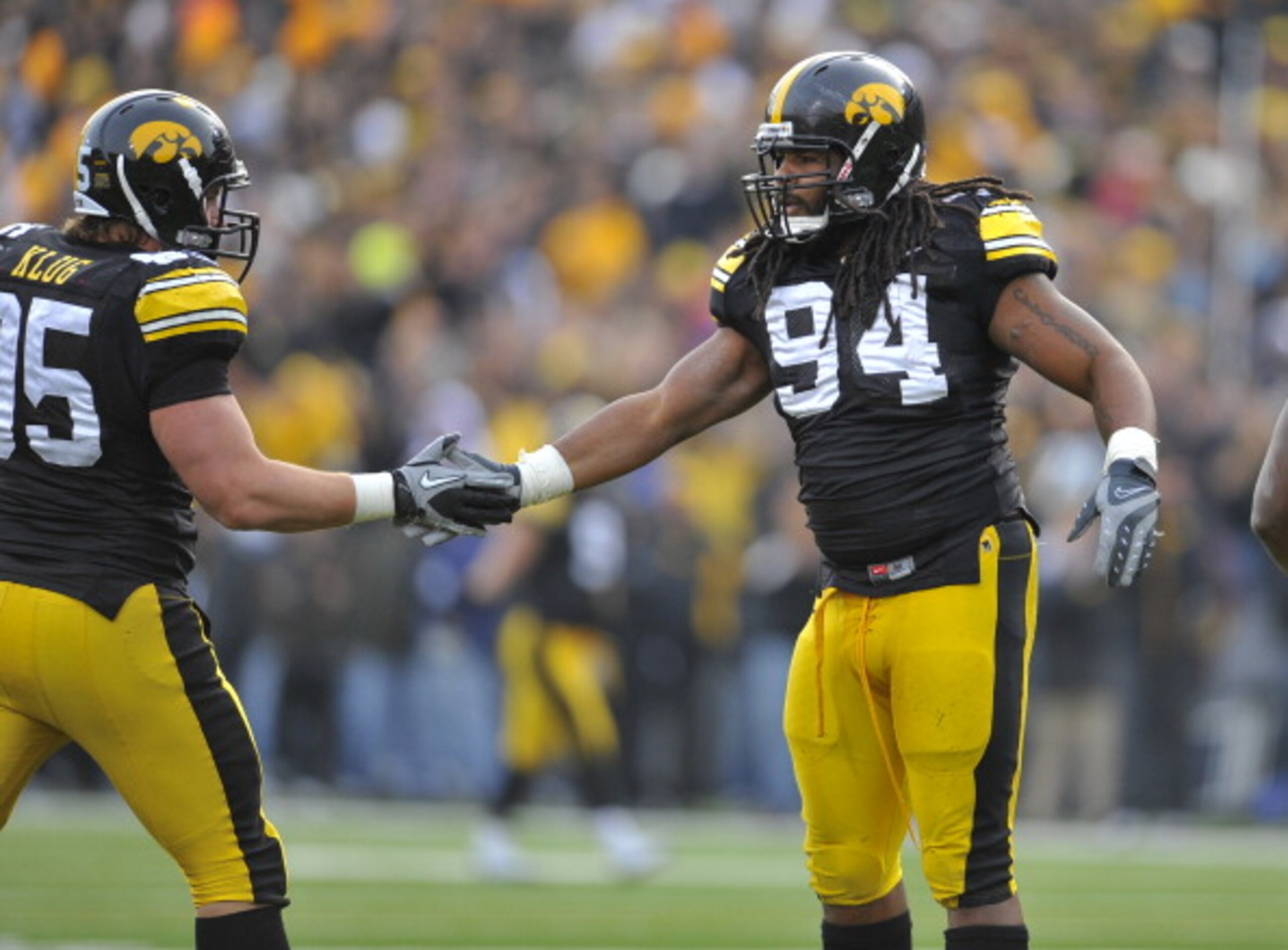 IOWA CITY, IA - NOVEMBER 20: Defensive linemen Adrian Clayborn #94 and Karly Klug #95 of the University of Iowa Hawkeyes celebrate a quarterback sack against the Ohio State Buckeyes during the first half of play at Kinnick Stadium on November 20, 2010 in IOWA CITY, IA - NOVEMBER 20: Defensive linemen Adrian Clayborn #94 and Karly Klug #95 of the University of Iowa Hawkeyes celebrate a quarterback sack against the Ohio State Buckeyes during the first half of play at Kinnick Stadium on November 20, 2010 in