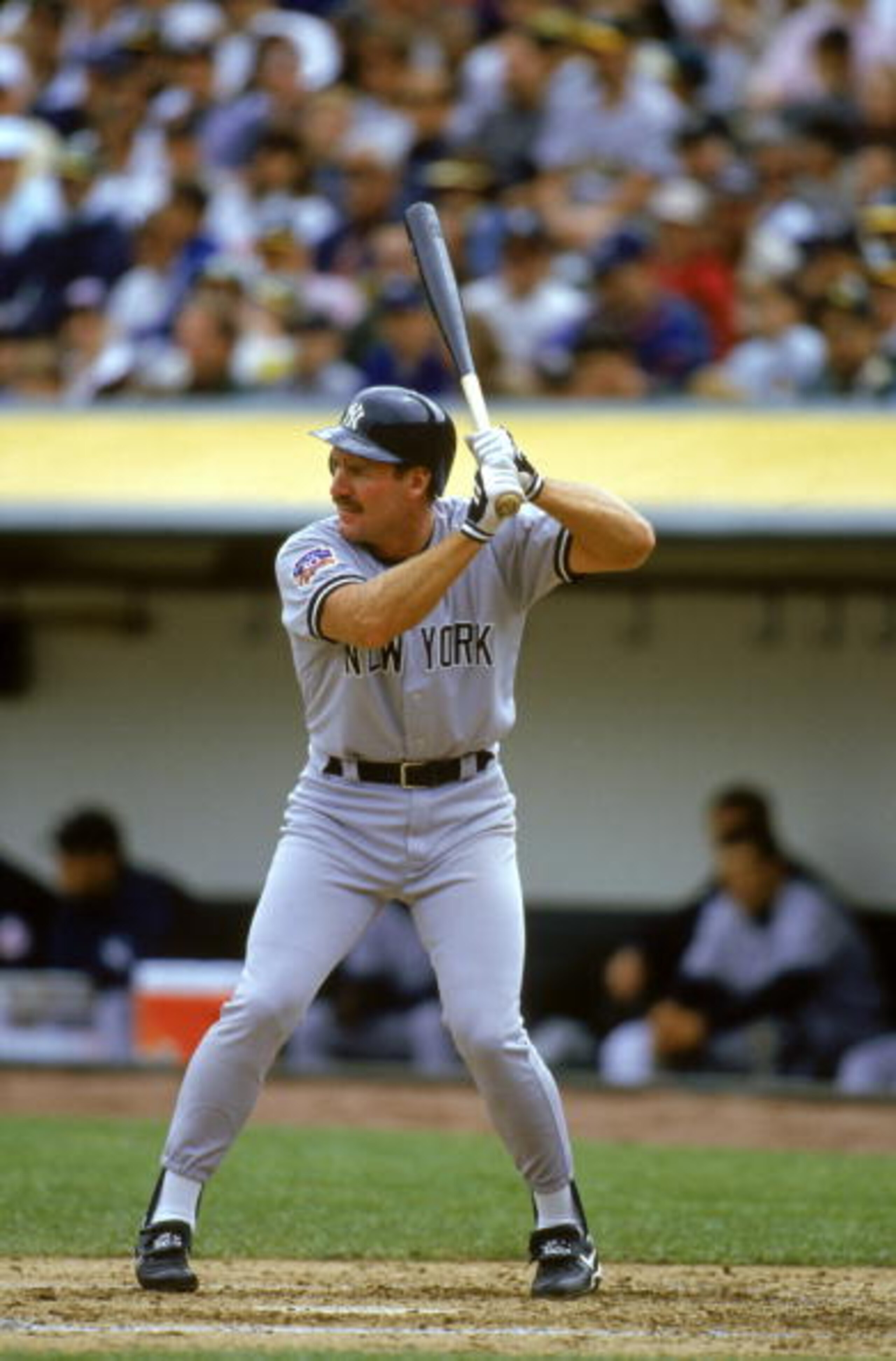 OAKLAND, CA - APRIL 6:  Wade Boggs #12 of the New York Yankees waits for an Oakland Athletics pitch during the game at the Oakland-Alameda County Coliseum in Oakland, California, on April 6, 1997.  The Athletics won 3-0. (Photo by Jed Jacobsohn/Getty Imag