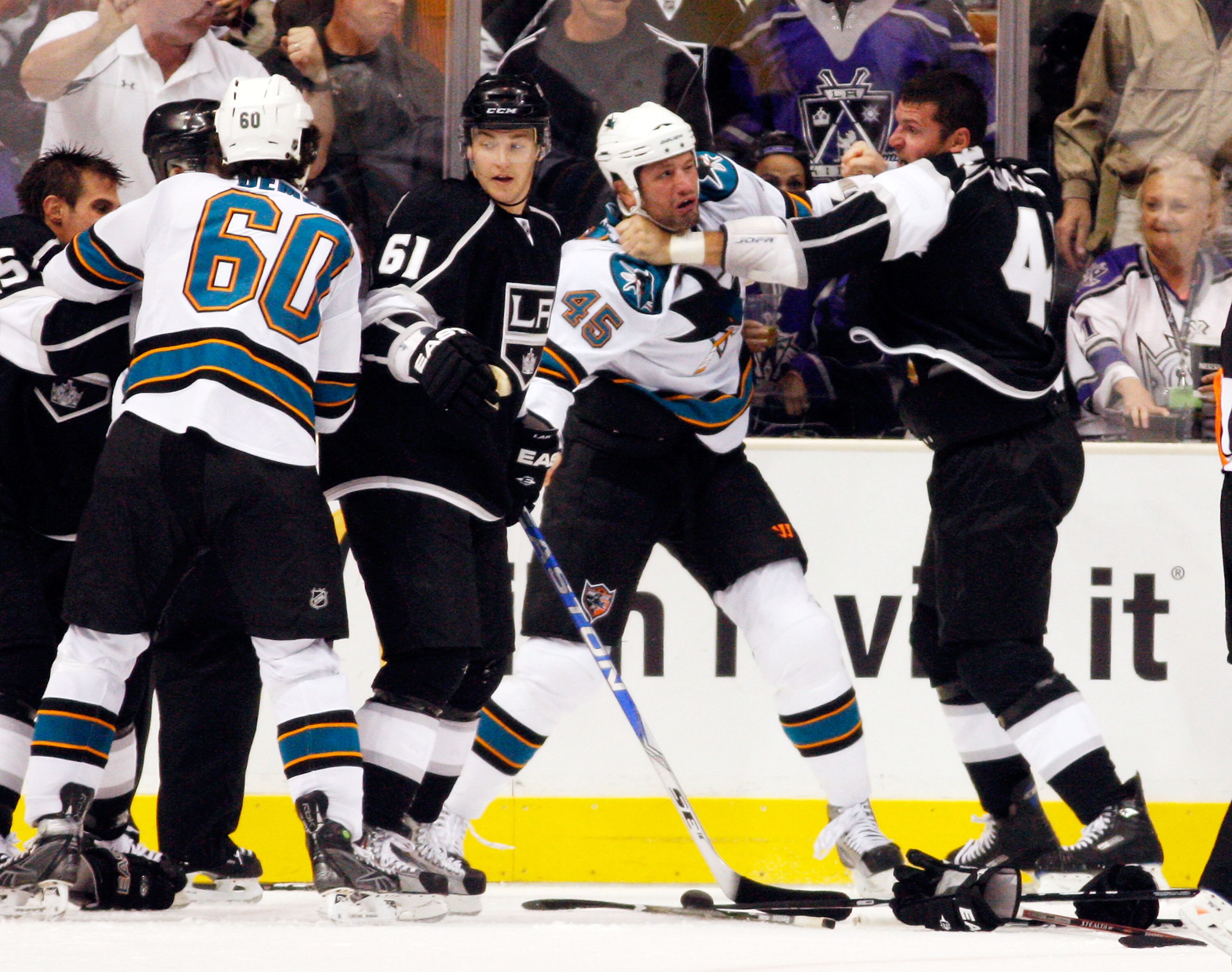 LOS ANGELES, CA - OCTOBER 06:  Jed Ortmeyer #45 of the San Jose Sharks and Raitis Ivanans #41 of the Los Angeles Kings fight during the second period of the NHL hockey game on October 6, 2009 in Los Angeles, California.  (Photo by Kevork Djansezian/Getty