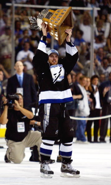TAMPA, FL - JUNE 7:   Brad Richards #19 of the Tampa Bay Lightning skates with the Conn Smythe trophy after defeating the Calgary Flames in game seven of the NHL Stanley Cup Finals on June 7, 2004 at the St. Pete Times Forum in Tampa, Florida.  The Lightn