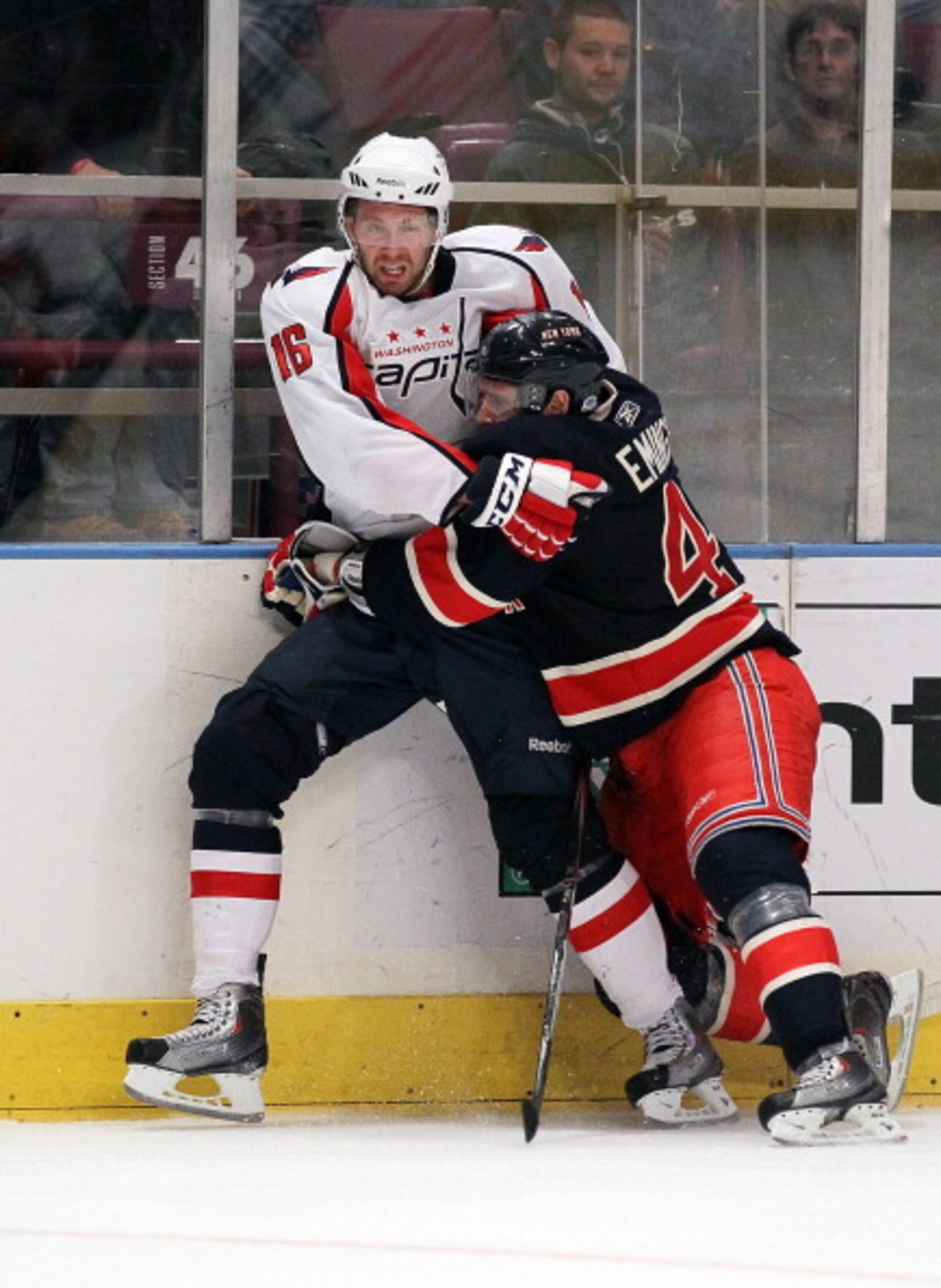 NEW YORK, NY - DECEMBER 12:  Eric Fehr #16 of the Washington Capitals gets tangles up with Steve Eminger #44 of the New York Rangers on December 12, 2010 at Madison Square Garden in New York City. The Rangers defeated the Capitals 7-0.  (Photo by Jim McIs