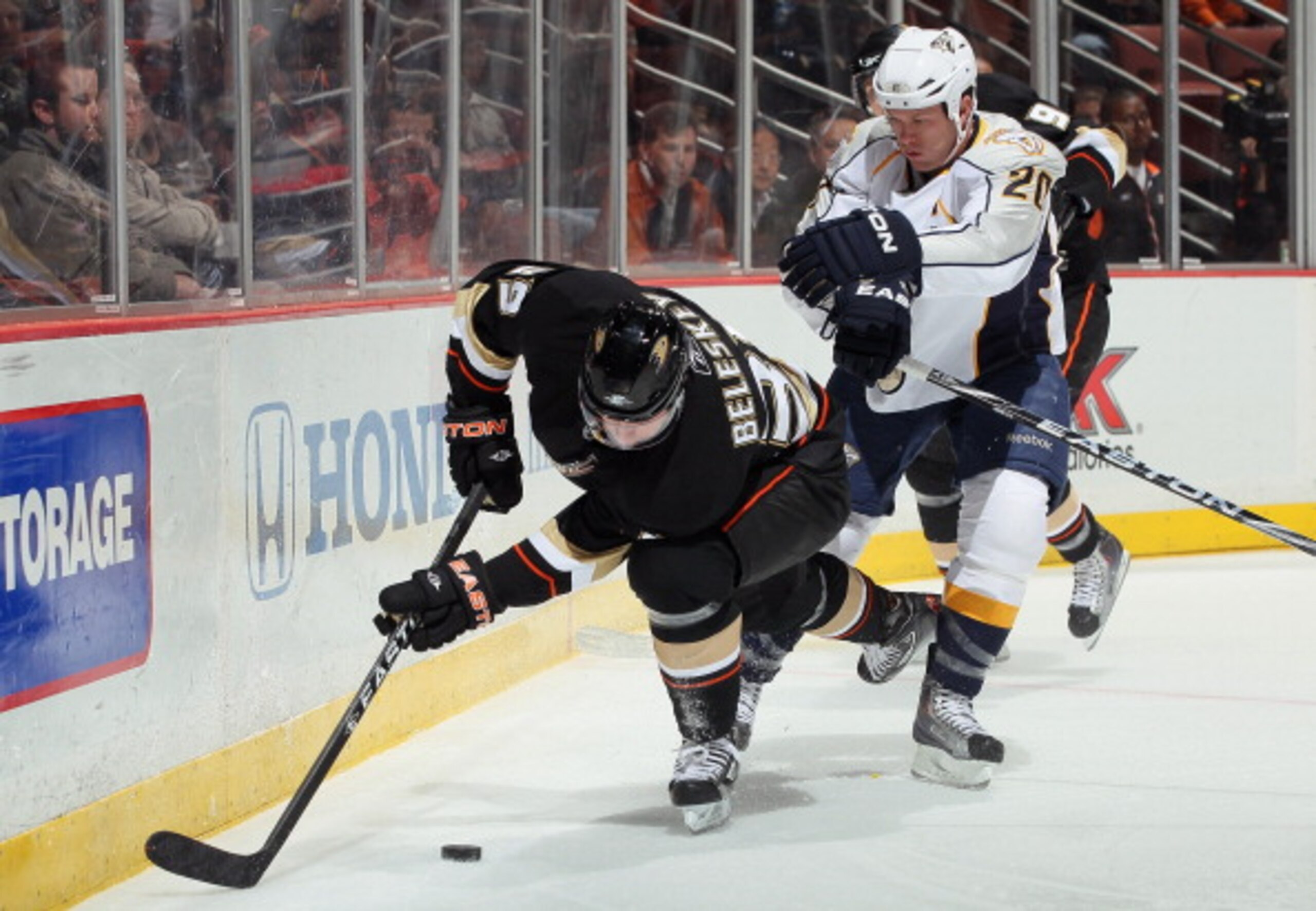 ANAHEIM, CA - JANUARY 05:  Matt Beleskey #39 of the Anaheim Ducks is checked off the puck by Ryan Suter #20 of the Nashville Predators in the first period at the Honda Center on January 5, 2011 in Anaheim, California. The Predators defeated the Ducks 4-1.