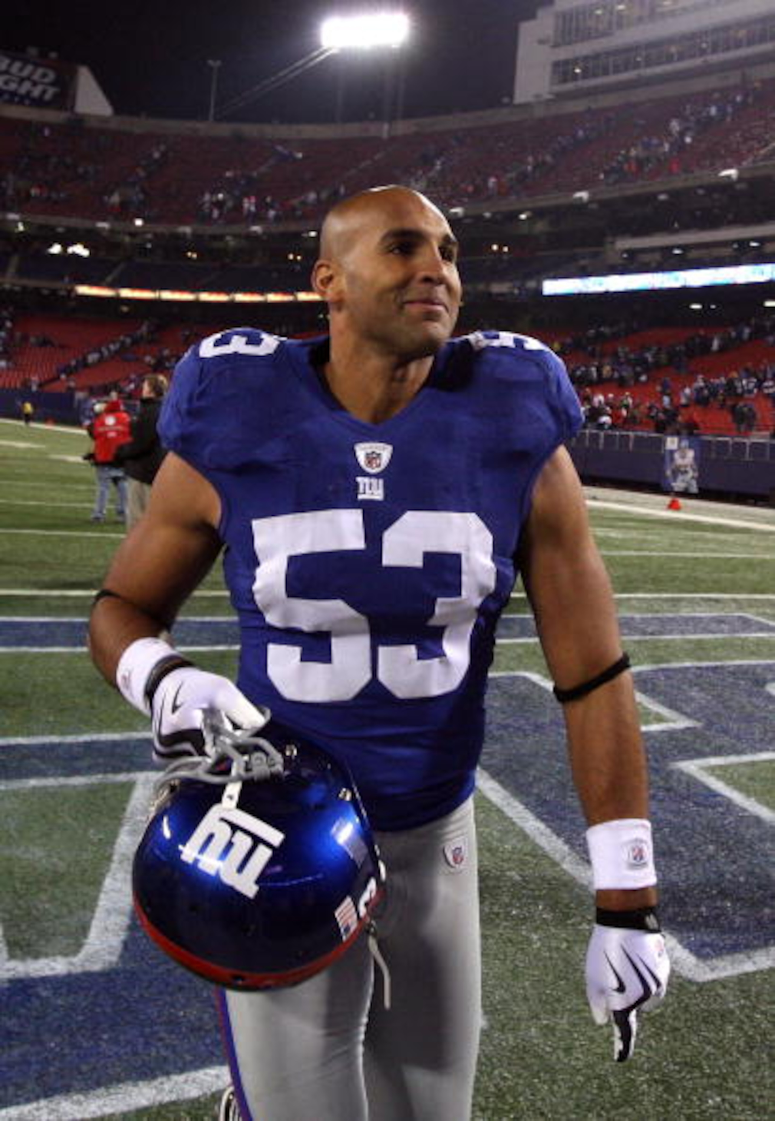 EAST RUTHERFORD, NJ - DECEMBER 06:  Bryan Kehl #53 of the New York Giants celebrates as he walks off the field after the Giants won 31-24 against the Dallas Cowboys at Giants Stadium on December 6, 2009 in East Rutherford, New Jersey.  (Photo by Jim McIsa