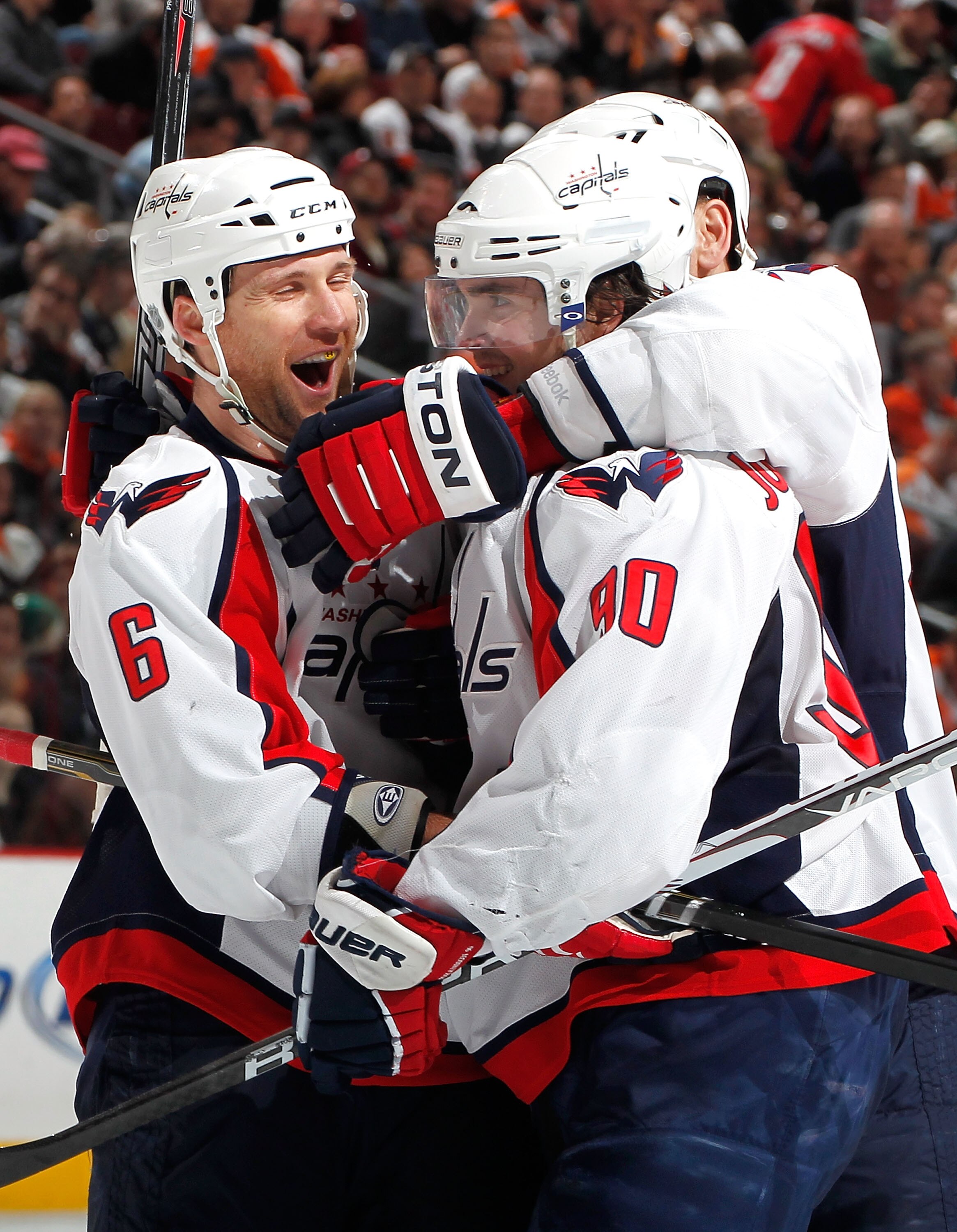 PHILADELPHIA, PA - MARCH 22:  Dennis Wideman #6 and Marcus Johansson #90 of the Washington Capitals celebrate a goal by Johansson against the Philadelphia Flyers during the third period of an NHL hockey game at the Wells Fargo Center on March 22, 2011 in 