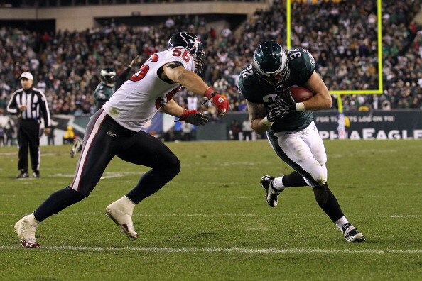 PHILADELPHIA, PA - DECEMBER 02:  Owen Schmitt #32 of the Philadelphia Eagles scores a 5-yard touchdown reception in the fourth quarter against Brian Cushing #56 of the Houston Texans at Lincoln Financial Field on December 2, 2010 in Philadelphia, Pennsylv