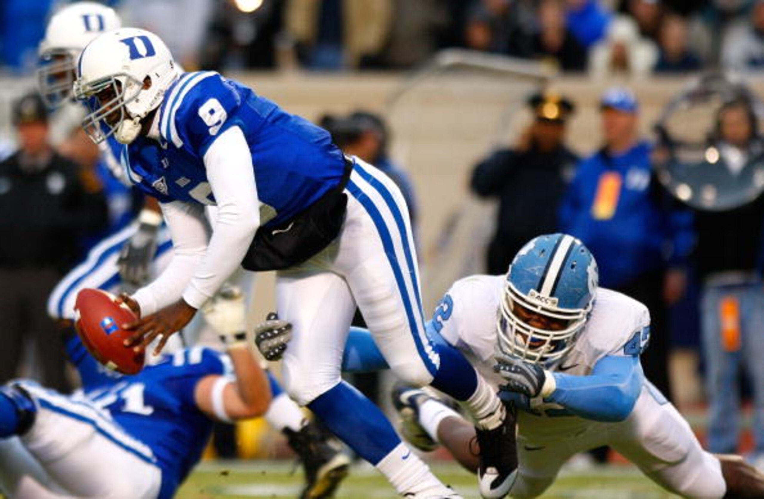DURHAM, NC - NOVEMBER 29: Quarterback Thaddeus Lewis #9 of the Duke Blue Devils is sacked by Robert Quinn #42 of the North Carolina Tar Heels during the game at Wallace Wade Stadium on November 29, 2008 in Durham, North Carolina. (Photo by Kevin C. Cox/ DURHAM, NC - NOVEMBER 29: Quarterback Thaddeus Lewis #9 of the Duke Blue Devils is sacked by Robert Quinn #42 of the North Carolina Tar Heels during the game at Wallace Wade Stadium on November 29, 2008 in Durham, North Carolina. (Photo by Kevin C. Cox/