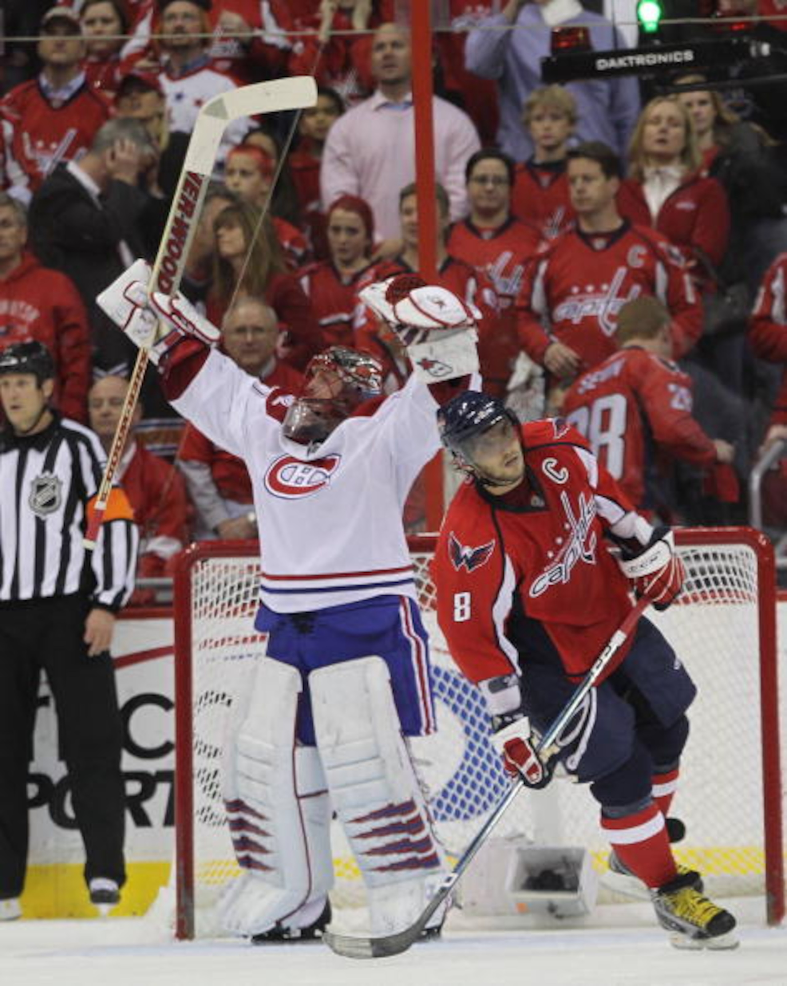 WASHINGTON - APRIL 28: Jaroslav Halak #41 of the Montreal Canadiens celebrates as Alex Ovechkin #8 of the Washington Capitals skates away following the Canadiens 2-1 win in Game Seven of the Eastern Conference Quarterfinals during the 2010 NHL Stanley Cup
