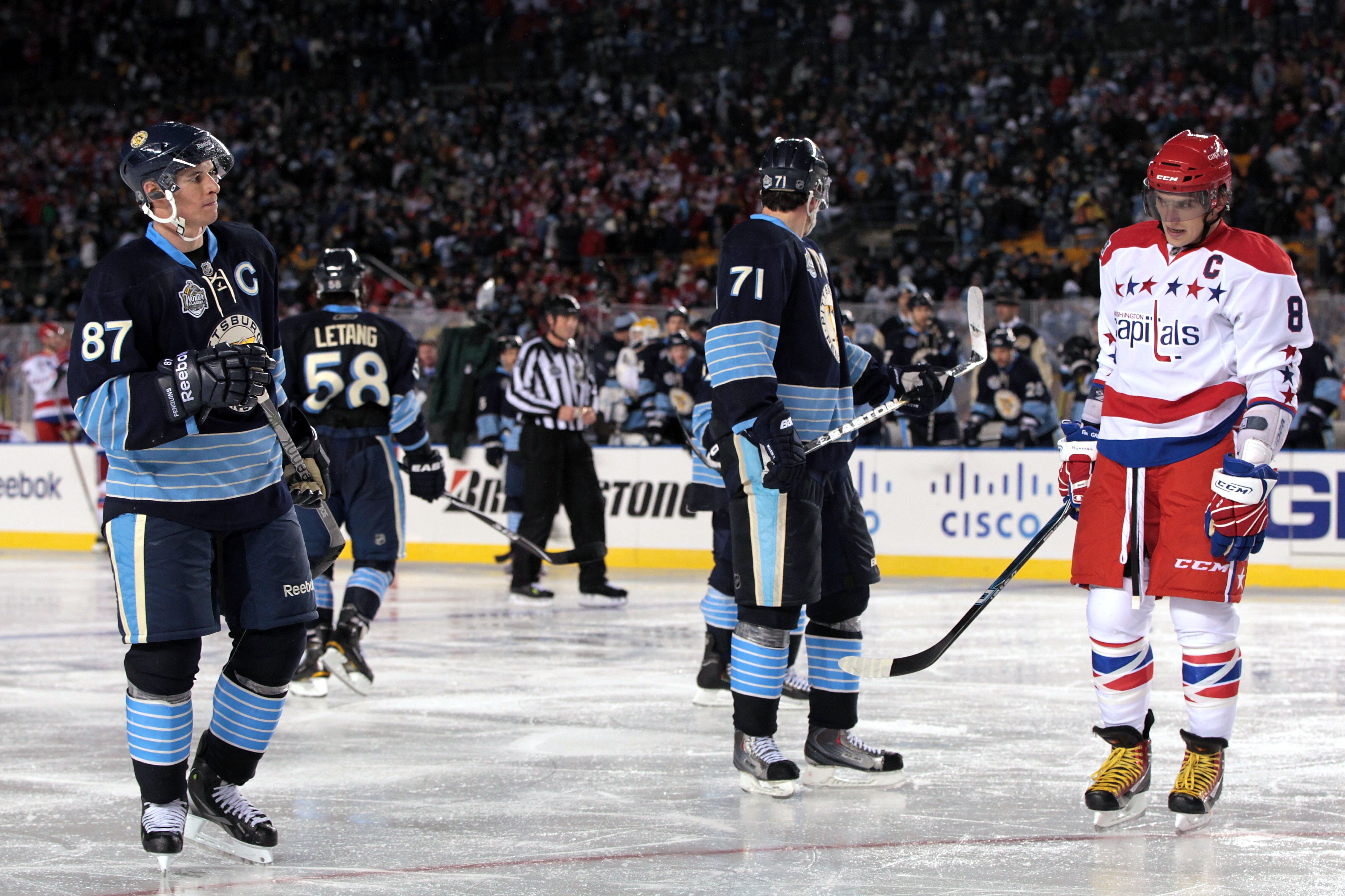 PITTSBURGH, PA - JANUARY 01:  Alex Ovechkin #8 of the Washington Capitals exchanges glances with Sidney Crosby #81 of the Pittsburgh Penguins during the 2011 NHL Bridgestone Winter Classic at Heinz Field on January 1, 2011 in Pittsburgh, Pennsylvania. Was