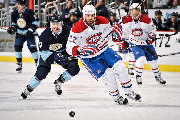 PITTSBURGH, PA - MARCH 12:  Pascal Dupuis #9 of the Pittsburgh Penguins and Paul Mara #22 of the Montreal Canadiens chase down a loose puck on March 12, 2011 at CONSOL Energy Center in Pittsburgh, Pennsylvania.  (Photo by Jamie Sabau/Getty Images)