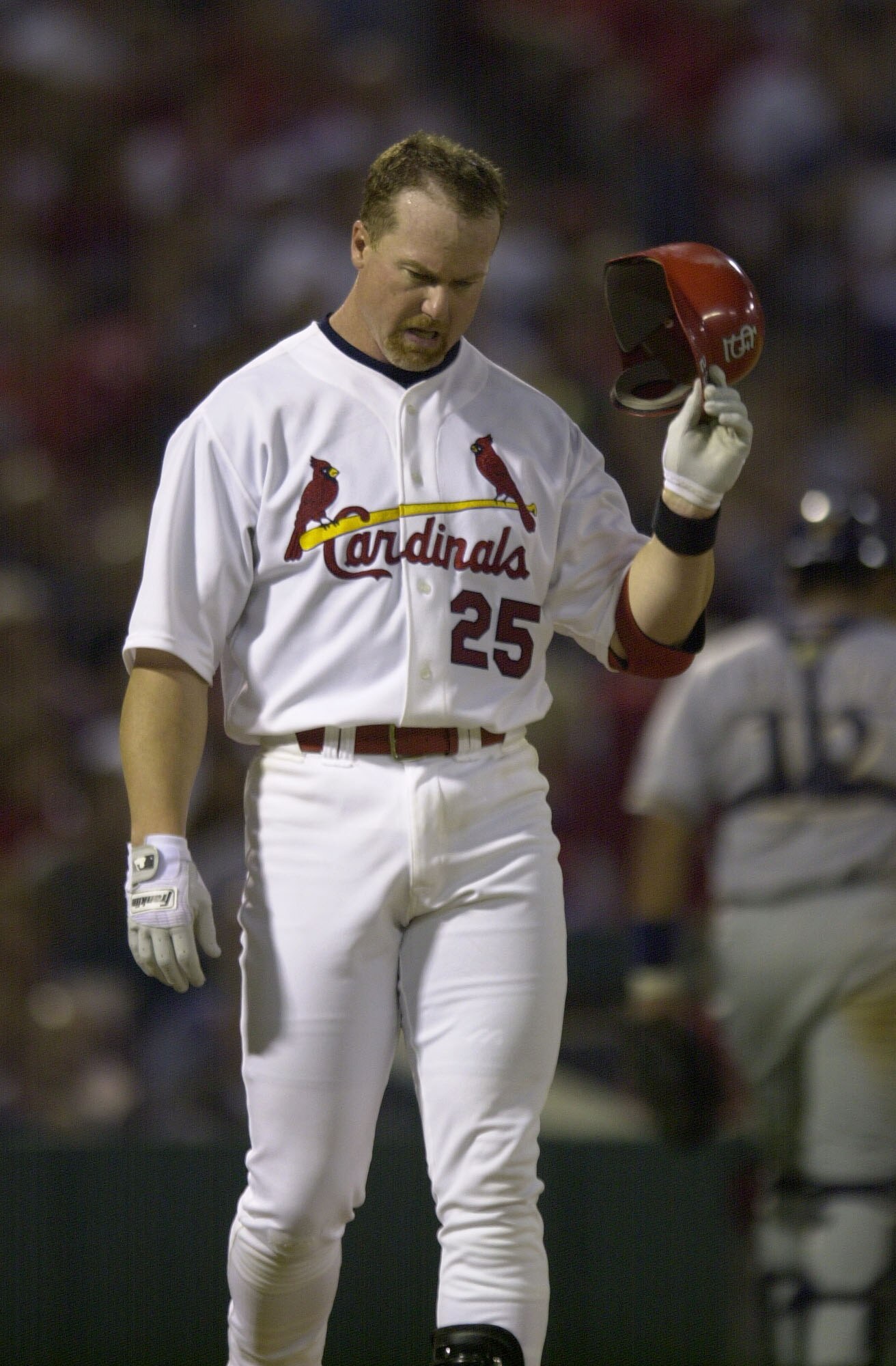 17 Sept 2001: First baseman Mark McGwire #25  throws his helmet during the game between the Cardinals and the Brewers at Busch stadium in St. Louis, Missouri.  The Cardinals defeated the Brewers 2-1.  DIGITAL IMAGE. Mandatory Credit: Elsa/ALLSPORT
