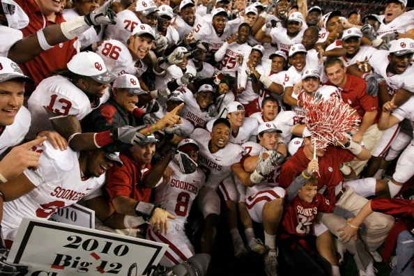 ARLINGTON, TX - DECEMBER 04:  The Oklahoma Sooners celebrates with the Big 12 Championship Trophy after the Sooners beat the Nebraska Cornhuskers 23-20 at Cowboys Stadium on December 4, 2010 in Arlington, Texas.  (Photo by Tom Pennington/Getty Images)