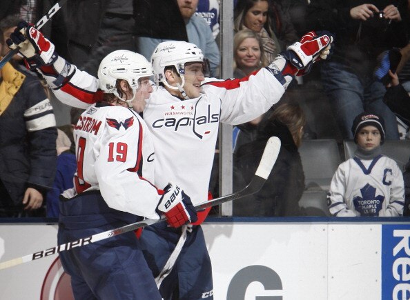 TORONTO, CANADA - JANUARY 22: Alex Ovechkin #8 and Nicklas Backstrom #19 of the Washington Capitals celebrates goal against the Toronto Maple Leafs during game action at the Air Canada Centre January 22, 2011 in Toronto, Ontario, Canada. (Photo by Abelima
