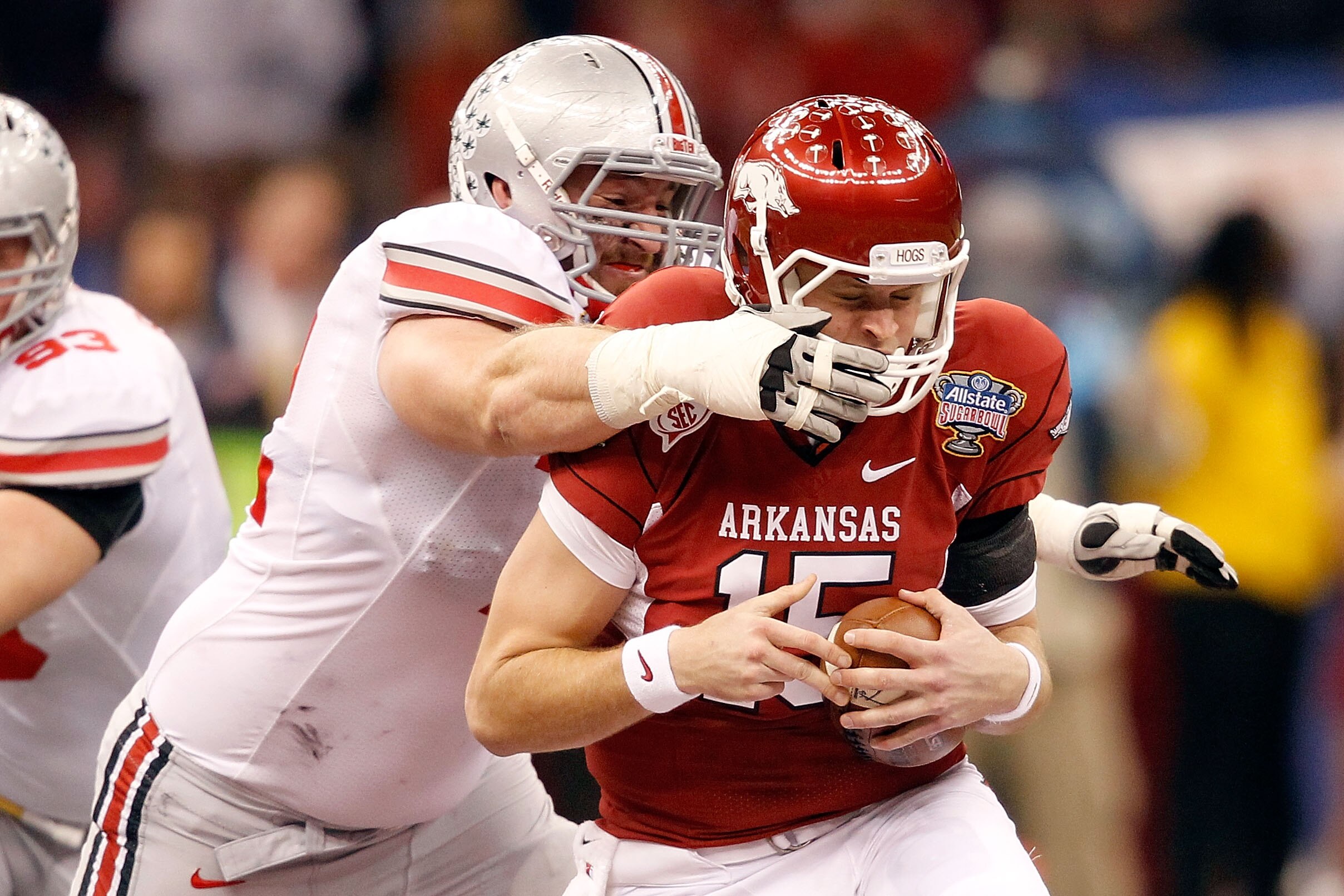 NEW ORLEANS, LA - JANUARY 04:  Dexter Larimore #72 of the Ohio State Buckeyes sacks Ryan Mallett #15 of the Arkansas Razorbacks in the second quarter during the Allstate Sugar Bowl at the Louisiana Superdome on January 4, 2011 in New Orleans, Louisiana.