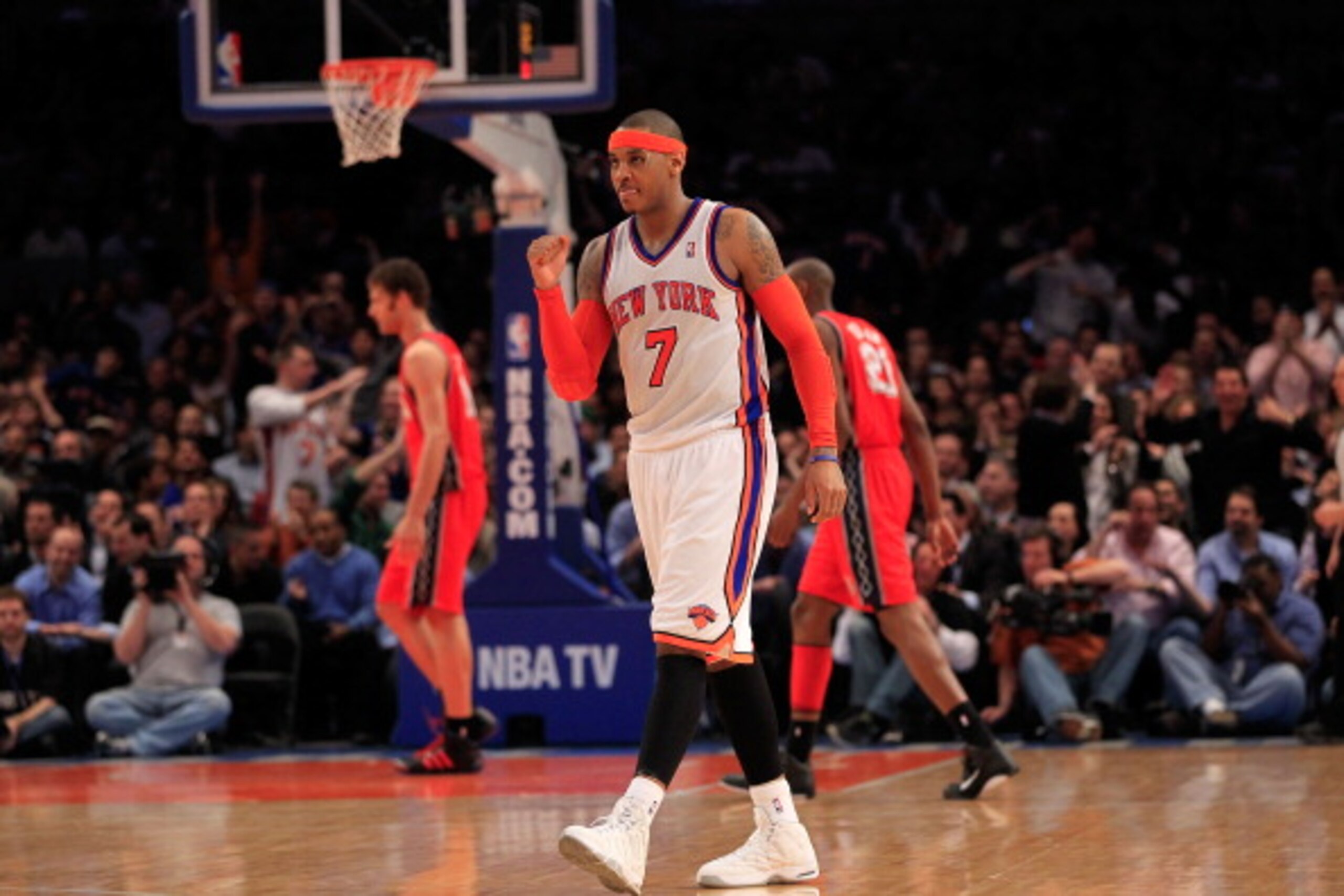 NEW YORK, NY - MARCH 30: Carmelo Anthony #7 of the New York Knicks celebrates during the game against the New Jersey Nets at Madison Square Garden on March 30, 2011 in New York City. NOTE TO USER: User expressly acknowledges and agrees that, by downloadi NEW YORK, NY - MARCH 30: Carmelo Anthony #7 of the New York Knicks celebrates during the game against the New Jersey Nets at Madison Square Garden on March 30, 2011 in New York City. NOTE TO USER: User expressly acknowledges and agrees that, by downloadi
