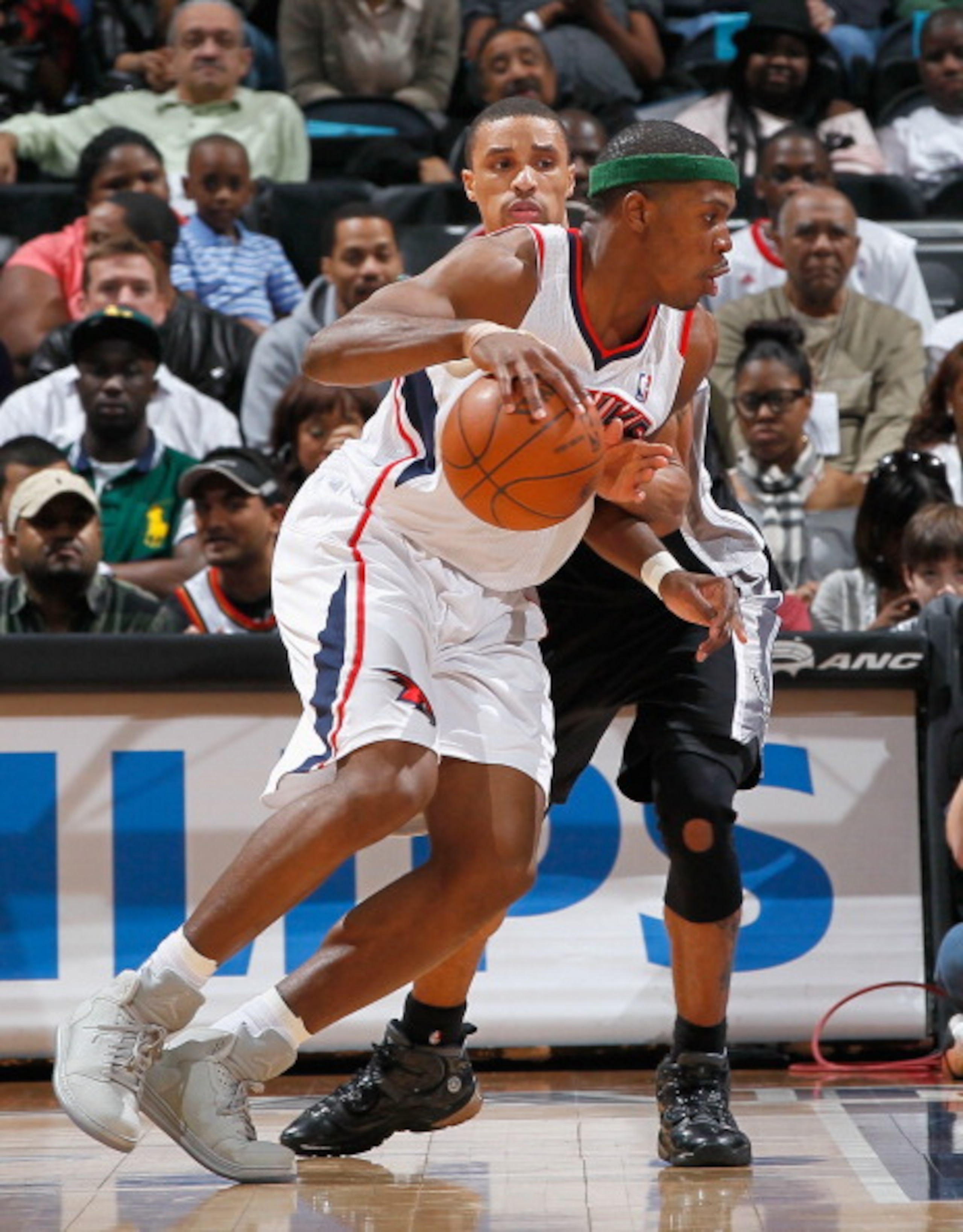 ATLANTA, GA - APRIL 05: Joe Johnson #2 of the Atlanta Hawks against George Hill #3 of the San Antonio Spurs at Philips Arena on April 5, 2011 in Atlanta, Georgia. NOTE TO USER: User expressly acknowledges and agrees that, by downloading and/or using thi ATLANTA, GA - APRIL 05: Joe Johnson #2 of the Atlanta Hawks against George Hill #3 of the San Antonio Spurs at Philips Arena on April 5, 2011 in Atlanta, Georgia. NOTE TO USER: User expressly acknowledges and agrees that, by downloading and/or using thi