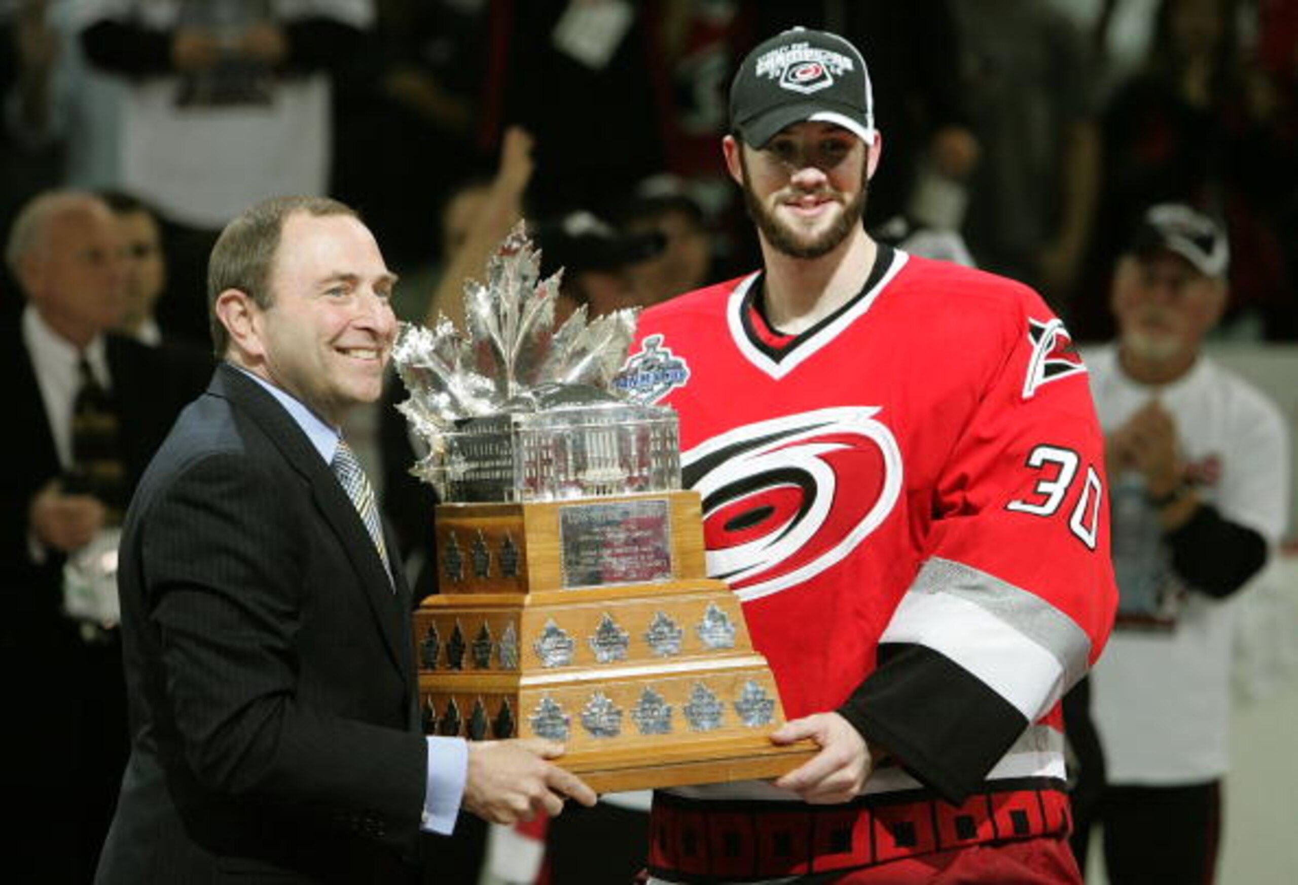 RALEIGH, NC - JUNE 19:  NHL commissioner Gary Bettman presents goaltender Cam Ward #30 of the Carolina Hurricanes the Conn Smythe trophy after defeating the Edmonton Oilers in game seven of the 2006 NHL Stanley Cup Finals on June 19, 2006 at the RBC Cente