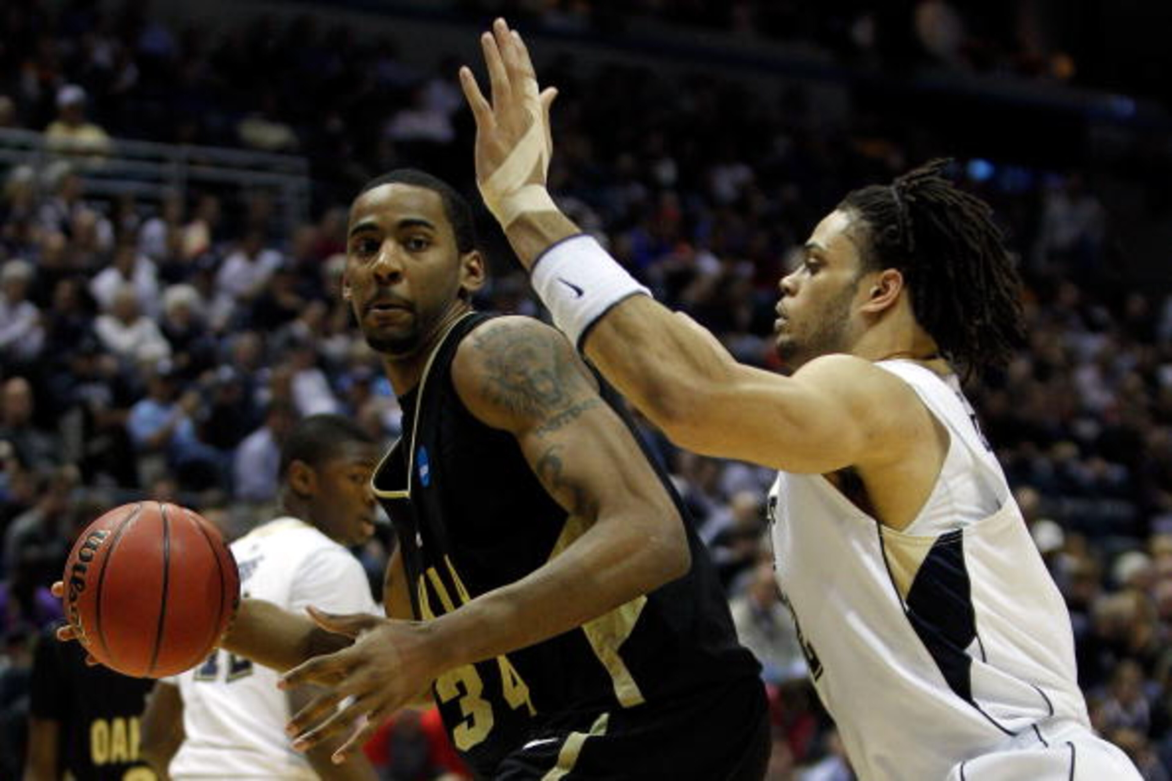 MILWAUKEE - MARCH 19:  Keith Benson #34 of the Oakland Golden Grizzlies drives on Gary McGhee #52 of the of the Pittsburgh Panthers in the first half during the first round of the 2010 NCAA men's basketball tournament at the Bradley Center on March 19, 20