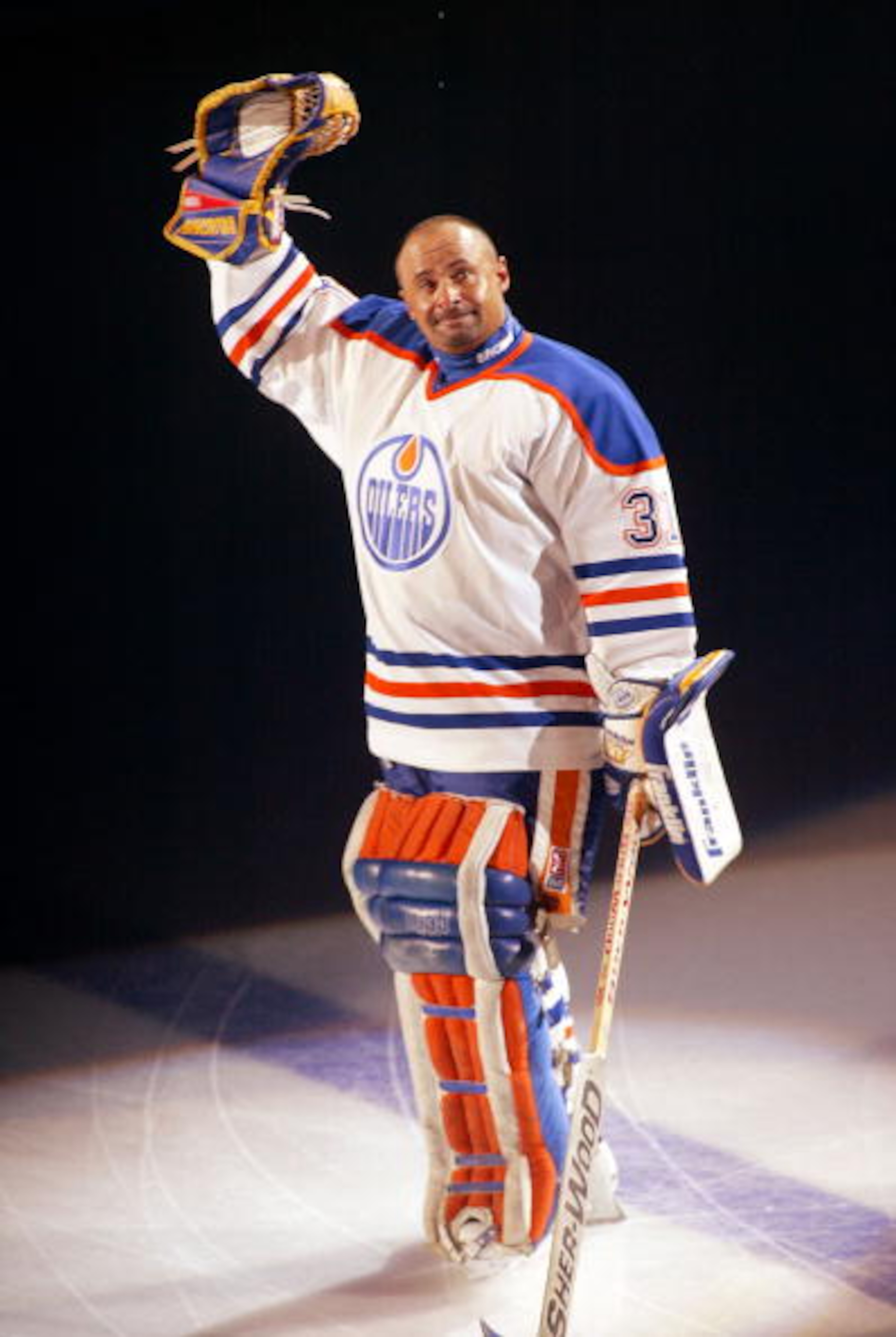EDMONTON, CANADA - OCTOBER 9:  Hall of Fame goalie Grant Fuhr #31 of the Edmonton Oilers waves to the crowd during his number retirement ceremony at the Skyreach Center October 9, 2003 in Edmonton, Alberta, Canada.  (Photo by Ian Tomlinson/Getty Images)
