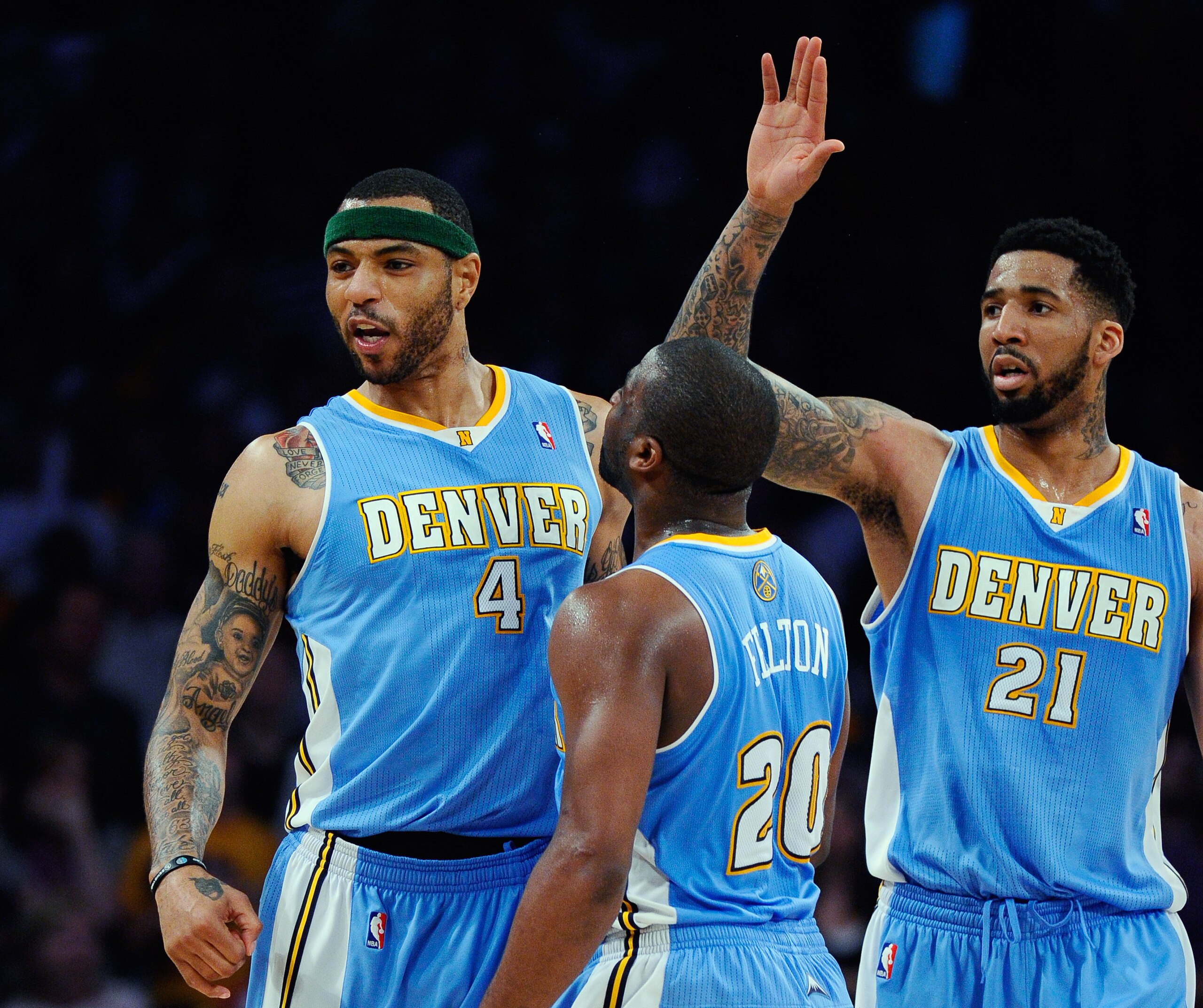 LOS ANGELES, CA - APRIL 03:  Kenyon Martin #4 of the Denver Nuggets celebrates with teammates Raymond Felton #20 and Wilson Chandler #21 after scoring a basket against the Los Angeles Lakers during the NBA basketball game at Staples Center on April 3, 201