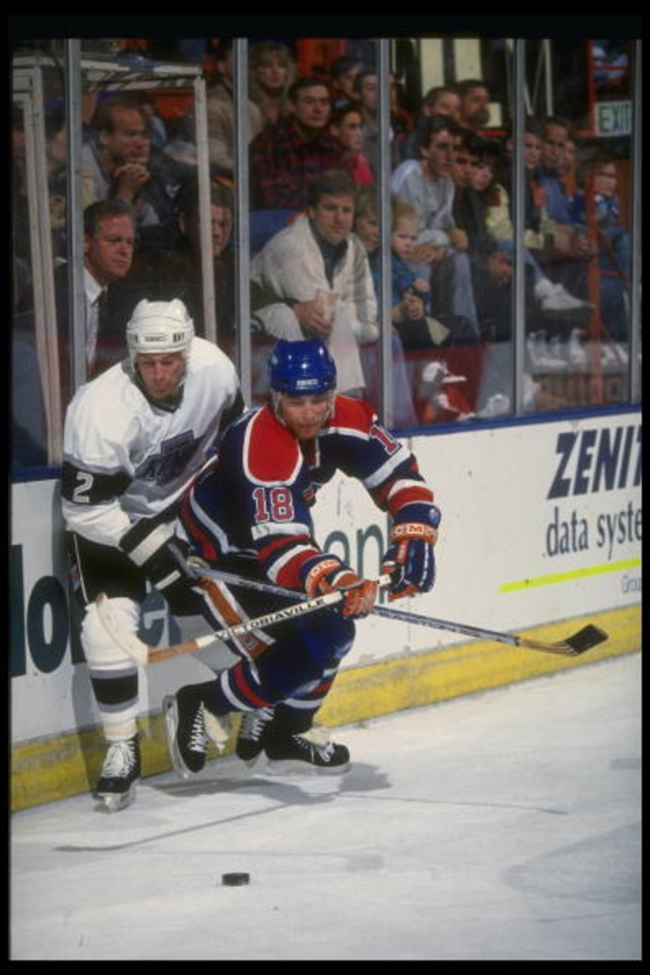 15 Dec 1990:  Defenseman Brian Benning #2 of the Los Angeles Kings ties up forward Craig Simpson #18 of the Edmonton Oilers during a game at the Great Western Forum in Inglewood, California. Mandatory Credit: Mike Powell  /Allsport