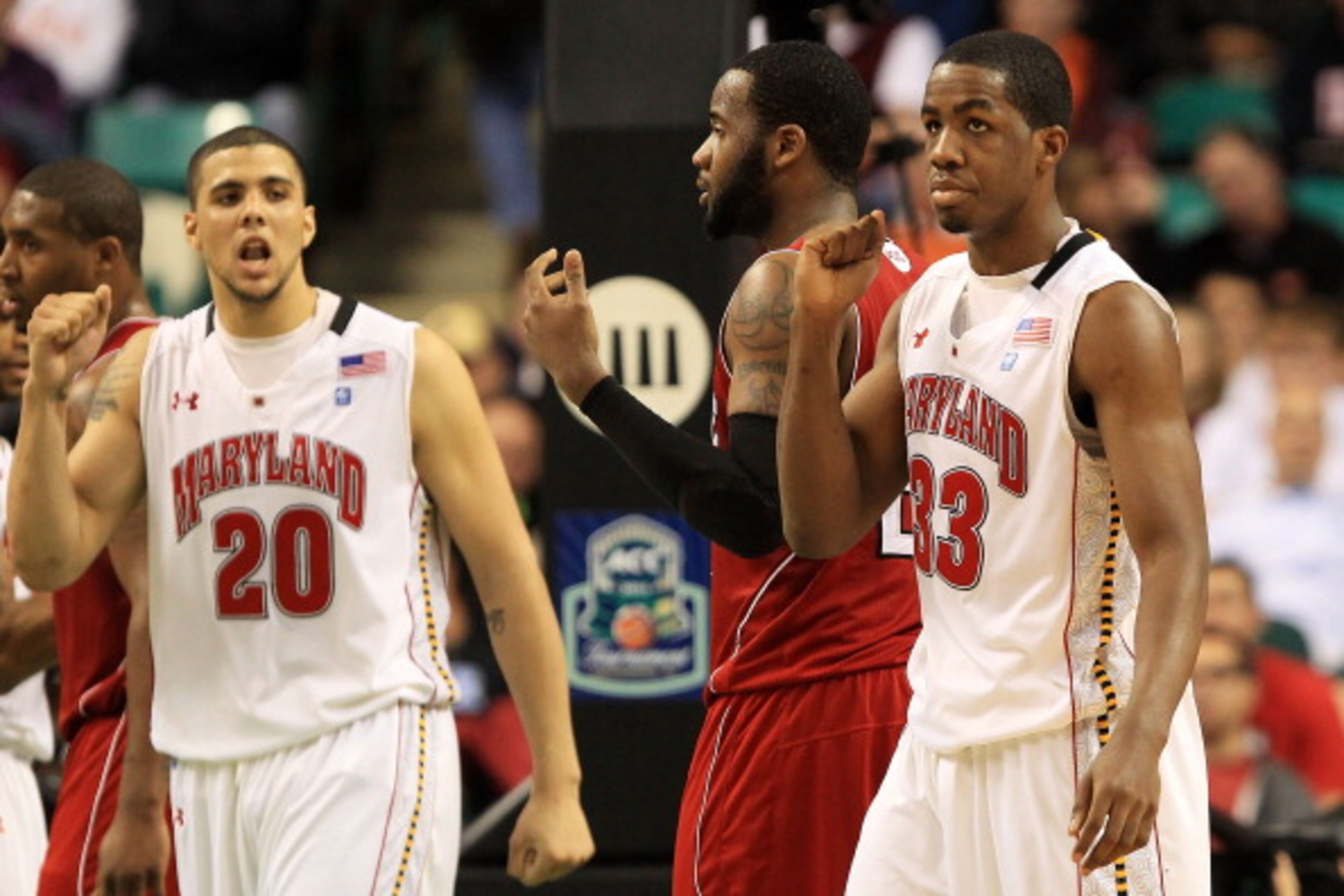 GREENSBORO, NC - MARCH 10:  Jordan Williams #20 and Dino Gregory of the Maryland Terrapins celebrate during the second half of the game against the North Carolina State Wolfpack in the first round of the 2011 ACC men's basketball tournament at the Greensb