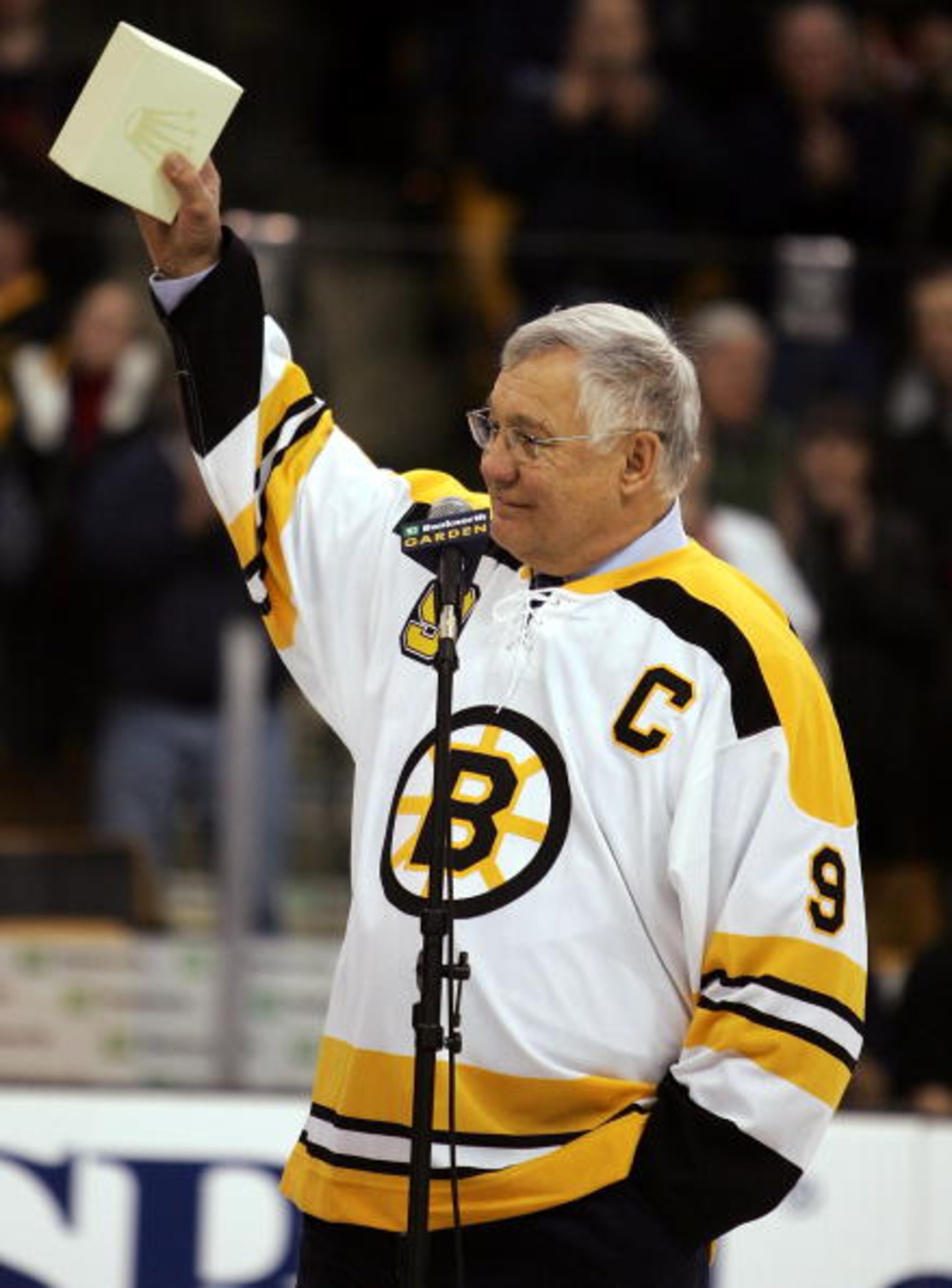 BOSTON - FEBRUARY 13:  John 'the Chief' Bucyk waves to the crowd during a ceremony to honor his fifty years with the Boston Bruins organization before the game between the Edmonton Oilers and the Boston Bruins on February 13, 2007 at the TD Banknorth Gard