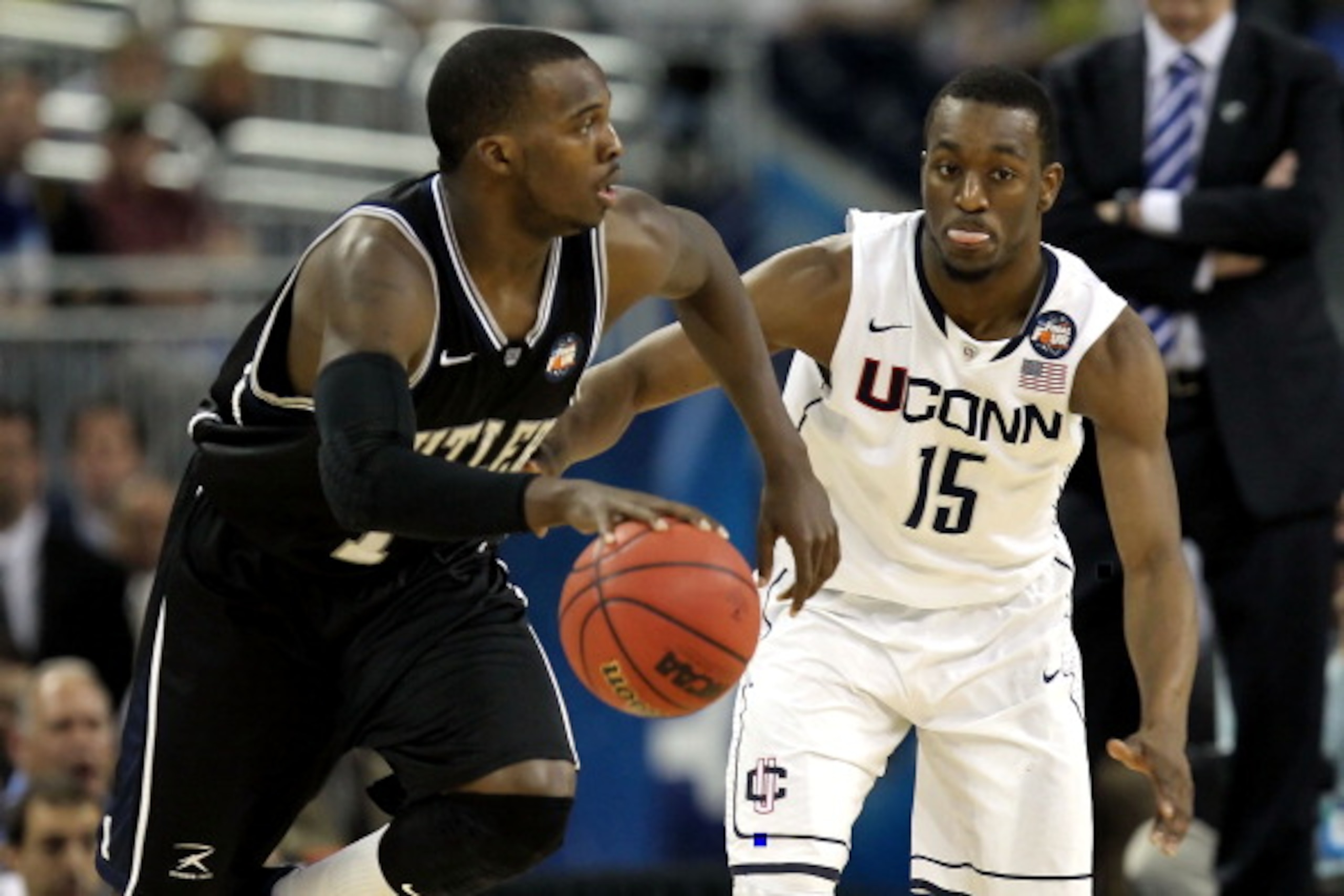 HOUSTON, TX - APRIL 04: Shelvin Mack #1 of the Butler Bulldogs handles the ball against Kemba Walker #15 of the Connecticut Huskies during the National Championship Game of the 2011 NCAA Division I Men's Basketball Tournament at Reliant Stadium on April HOUSTON, TX - APRIL 04: Shelvin Mack #1 of the Butler Bulldogs handles the ball against Kemba Walker #15 of the Connecticut Huskies during the National Championship Game of the 2011 NCAA Division I Men's Basketball Tournament at Reliant Stadium on April