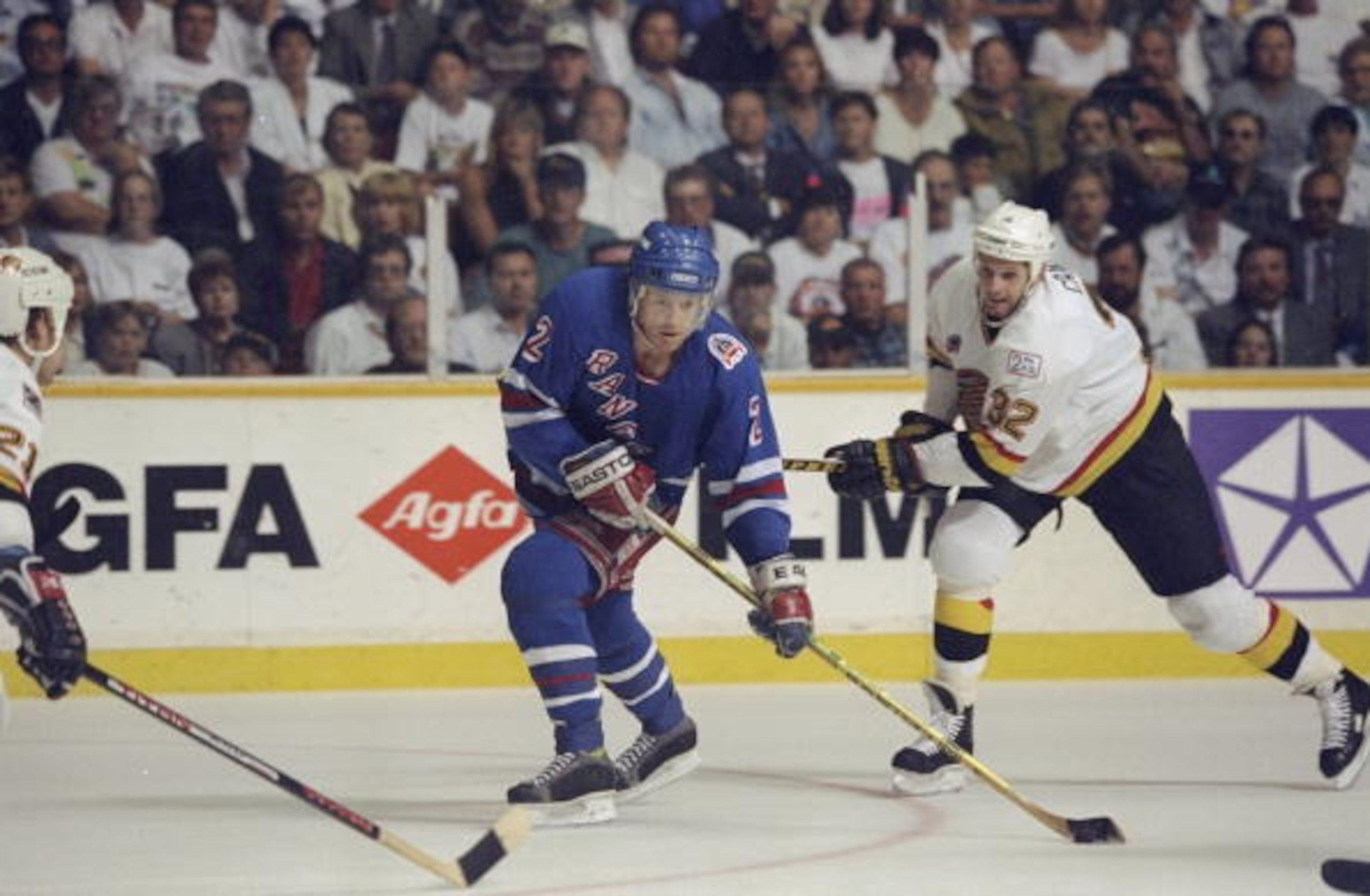 Jun 1994: Brian Leetch #2 of the New York Rangers tries to get the puck during the Stanley Cup Finals against the Vancover Canucks at the Pacific Coliseum in Vancover, Canada. Mandatory Credit: Mike Powell  /Allsport