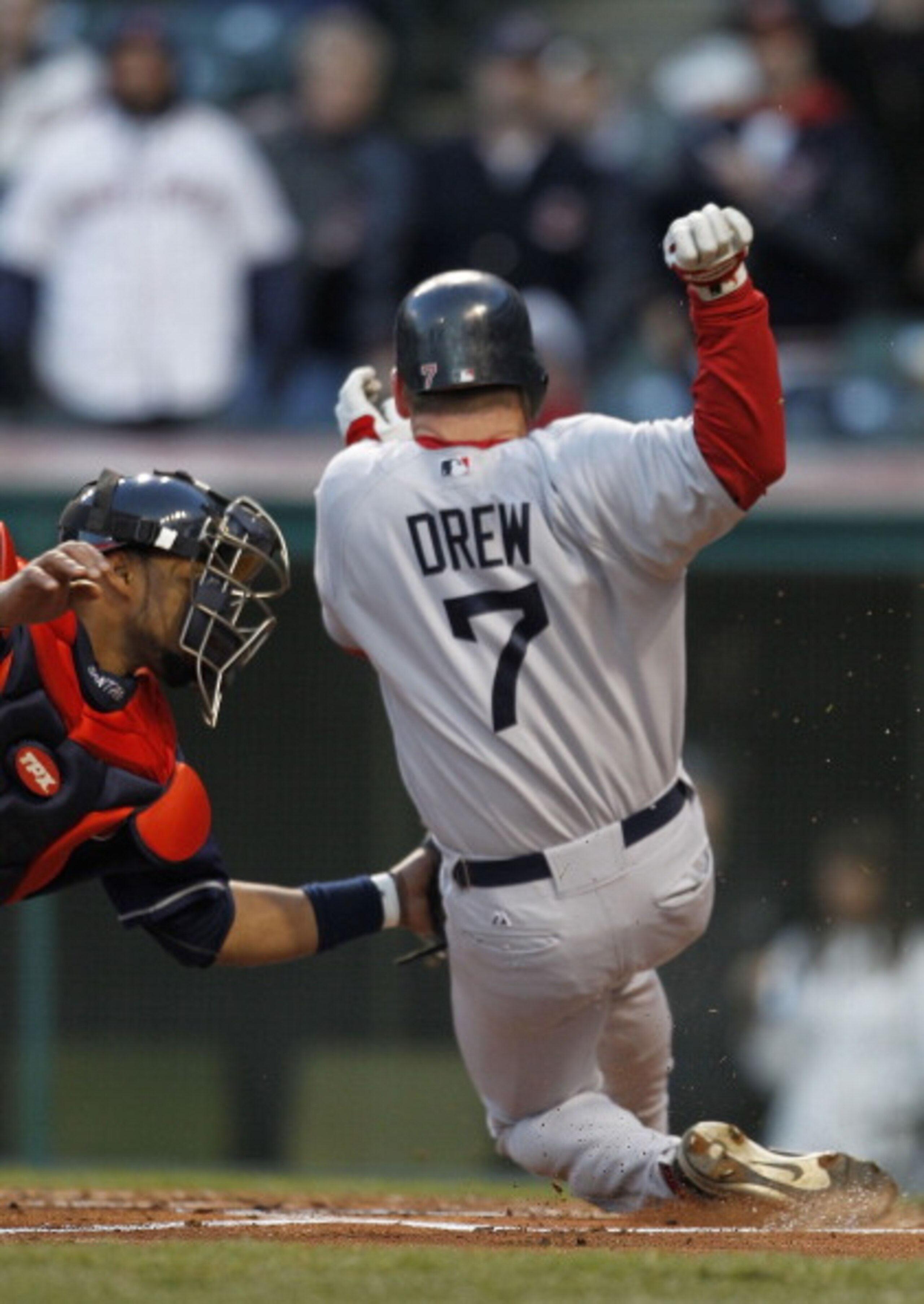 CLEVELAND - APRIL 05: Carlos Santana #41 of the Cleveland Indians tags out J.D. Drew #7 of the Boston Red Sox during the second inning of the game at Progressive Field on April 5, 2011 in Cleveland, Ohio.  (Photo by Leon Halip/Getty Images)
