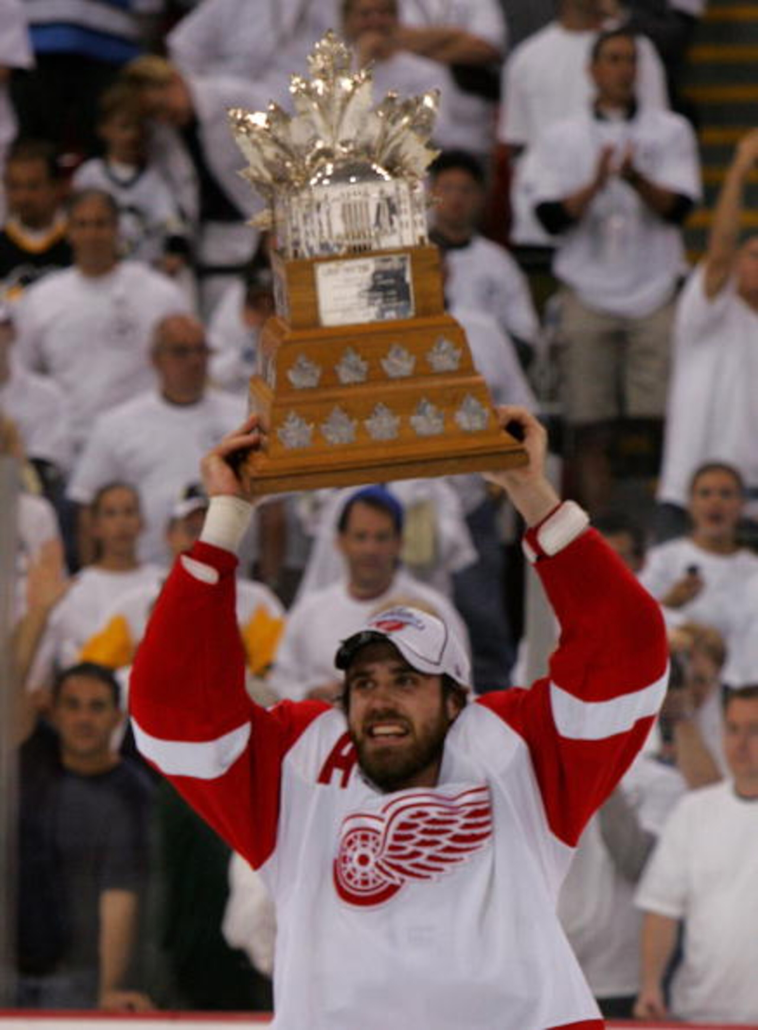 PITTSBURGH - JUNE 04: Stanley Cup Playoff MVP, Henrik Zetterberg #40 of the Detroit Red Wings skates with the Conn Smythe trophy after defeating the Pittsburgh Penguins in game six of the 2008 NHL Stanley Cup Finals at Mellon Arena on June 4, 2008 in Pitt