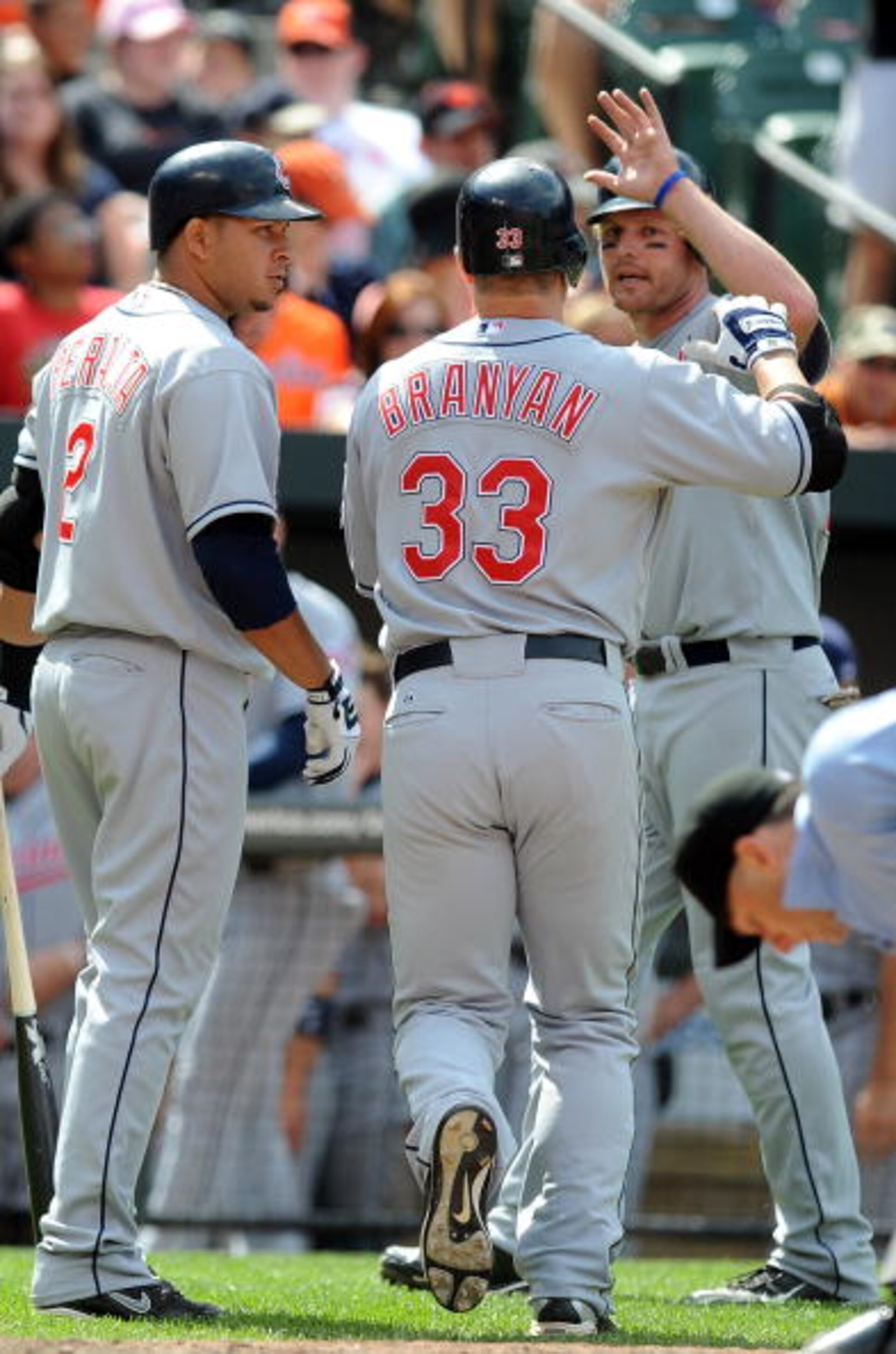 BALTIMORE - MAY 16:  Russell Branyon #33 of the Cleveland Indians is congratulated by Jhonny Peralta #2 and Austin Kearns #26 after hitting a home run in the ninth inning against the Baltimore Orioles at Camden Yards on May 16, 2010 in Baltimore, Maryland