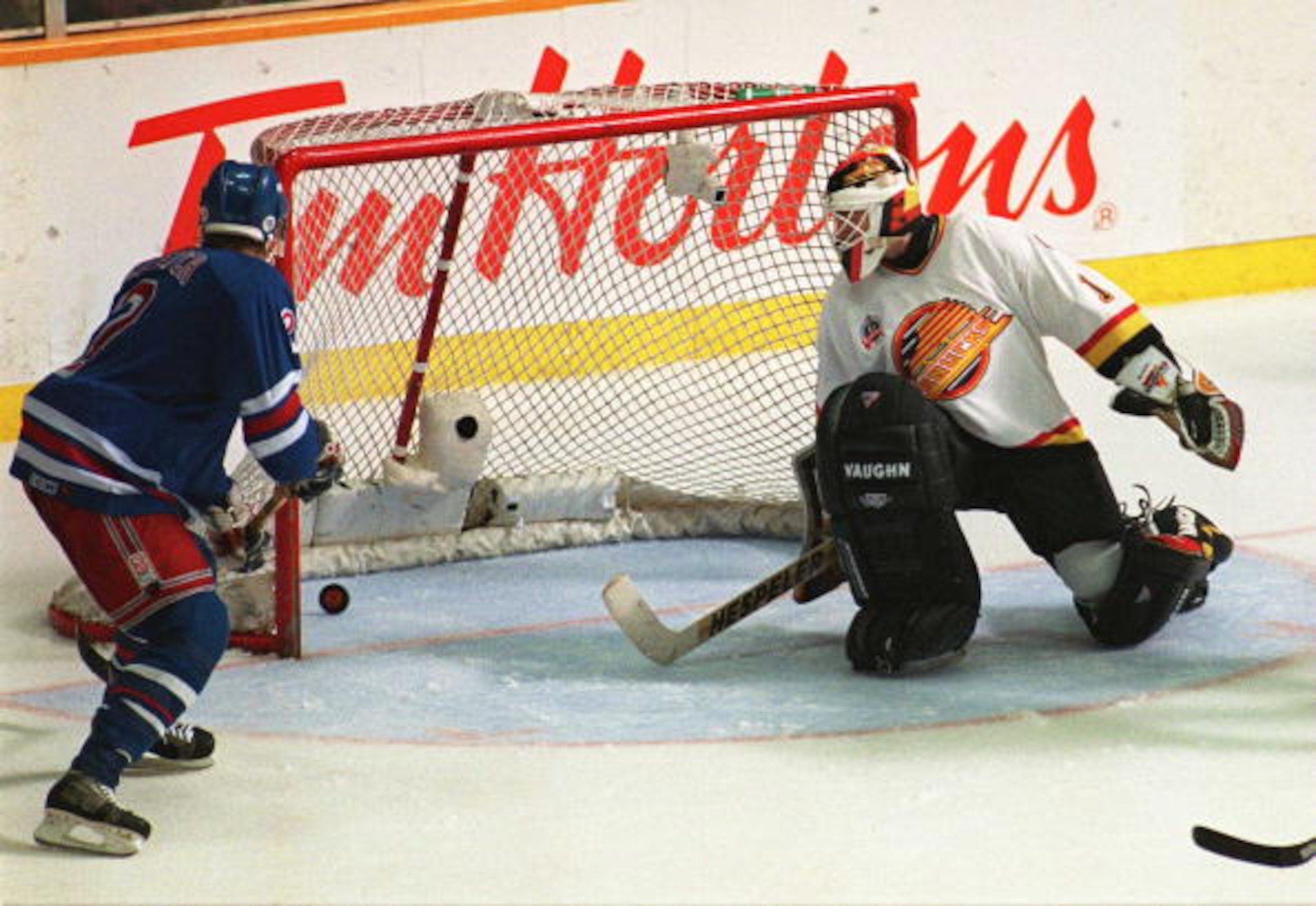 11 JUN 1994: CANUCKS GOALTENDER KIRK MCLEAN REACTS TOO LATE TO STOP A SHOT BY THE RANGER''S ALEXEI KOVALEV AS RANGER BRIAN LEETCH, AT LEFT, LOOKS ON IN THE SECOND PERIOD OF GAME SIX OF THE STANLEY CUP FINALS IN VANCOUVER, BRITISH COLUMBIA. THE GOAL CUT TH