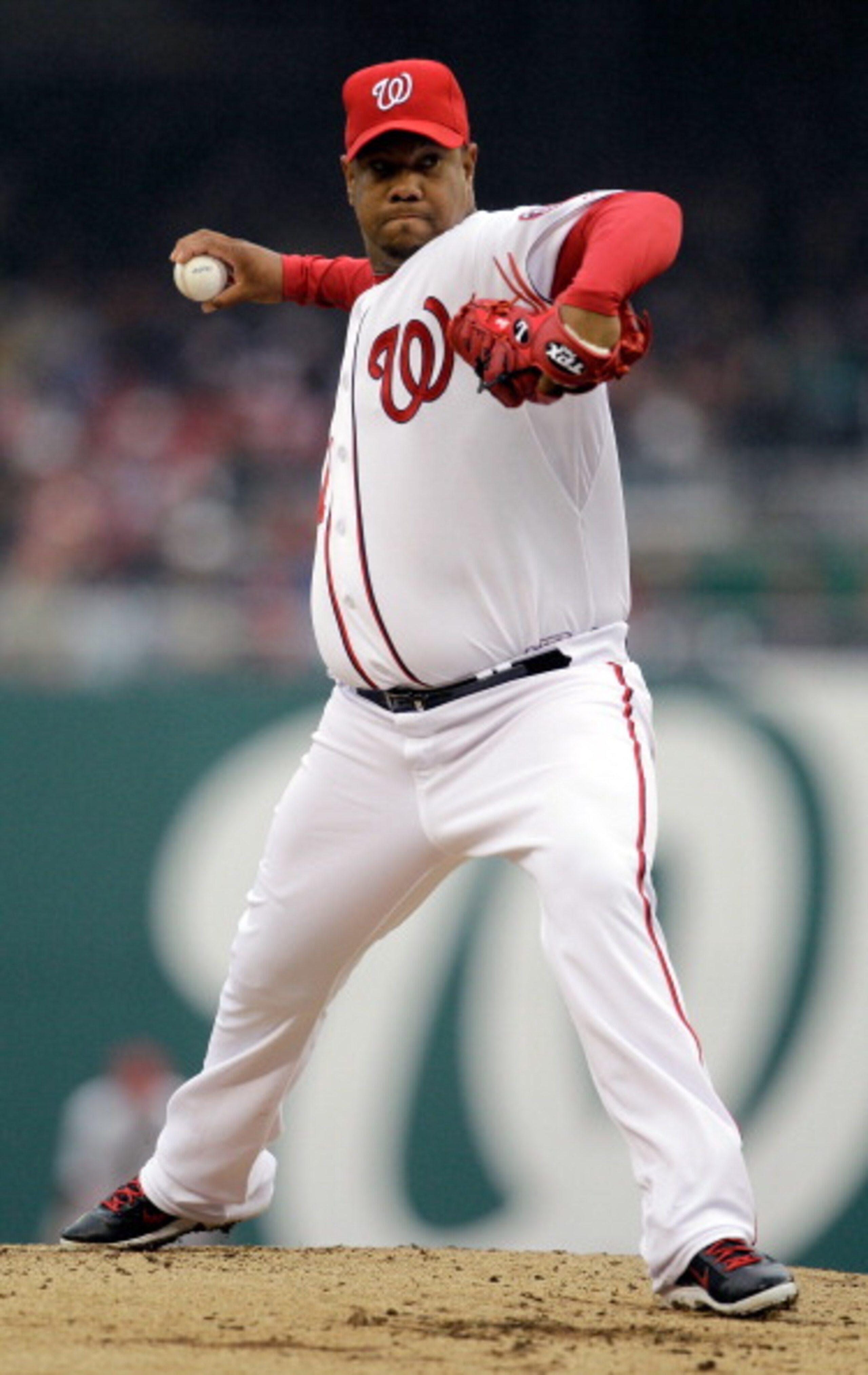 WASHINGTON, DC - MARCH 31: Starting pitcher Livan Hernandez #61 of the Washington Nationals delivers to a Atlanta Braves batter during the third inning at Nationals Park on March 31, 2011 in Washington, DC.  (Photo by Rob Carr/Getty Images)
