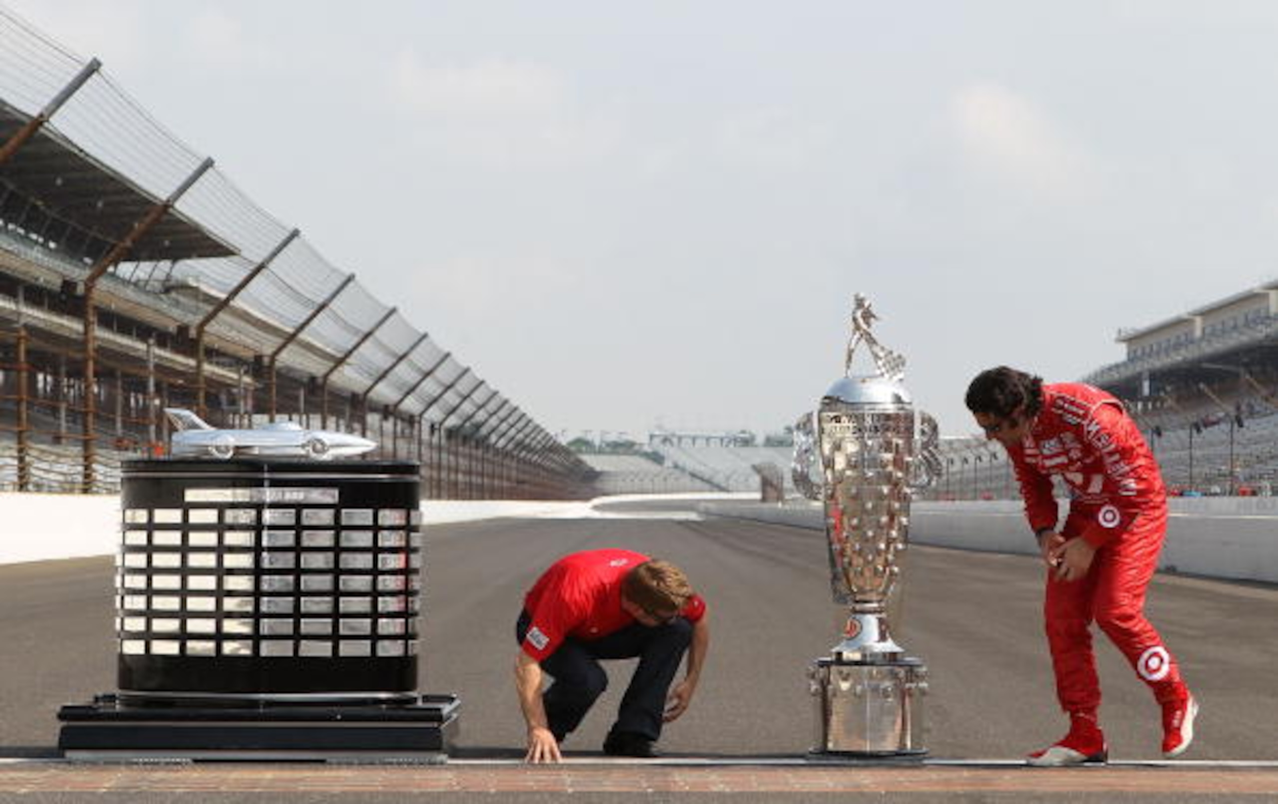 INDIANAPOLIS - MAY 31:  (R-L)  Dario Franchitti of Scotland, driver of the #10 Target Chip Ganassi Racing Dallara Honda and Chip Ganassi Racing Nascar driver and 2010 Daytona 500 winner Jamie McMurray with the Harley J. Earl trophy and the Borg Warner tro