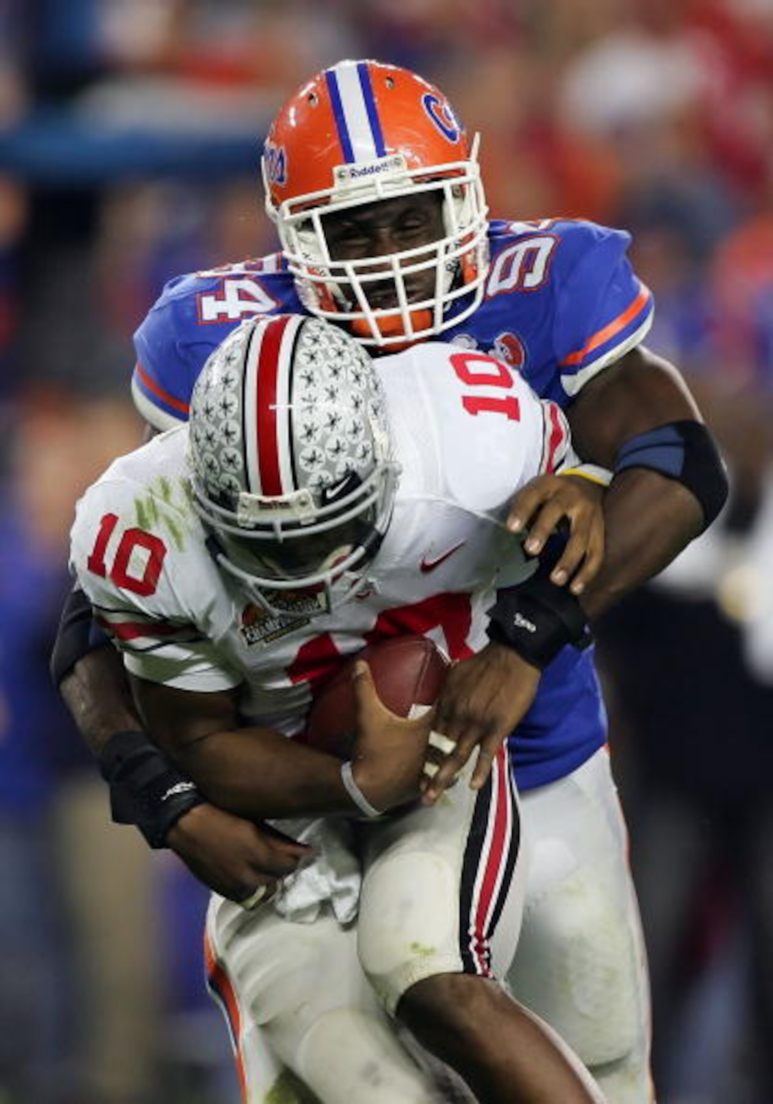 GLENDALE, AZ - JANUARY 08:  Defensive end Jarvis Moss #94 of the Florida Gators sacks Troy Smith #10 of the Ohio State Buckeyes in the second half during the 2007 Tostitos BCS National Championship Game at the University of Phoenix Stadium on January 8, 2