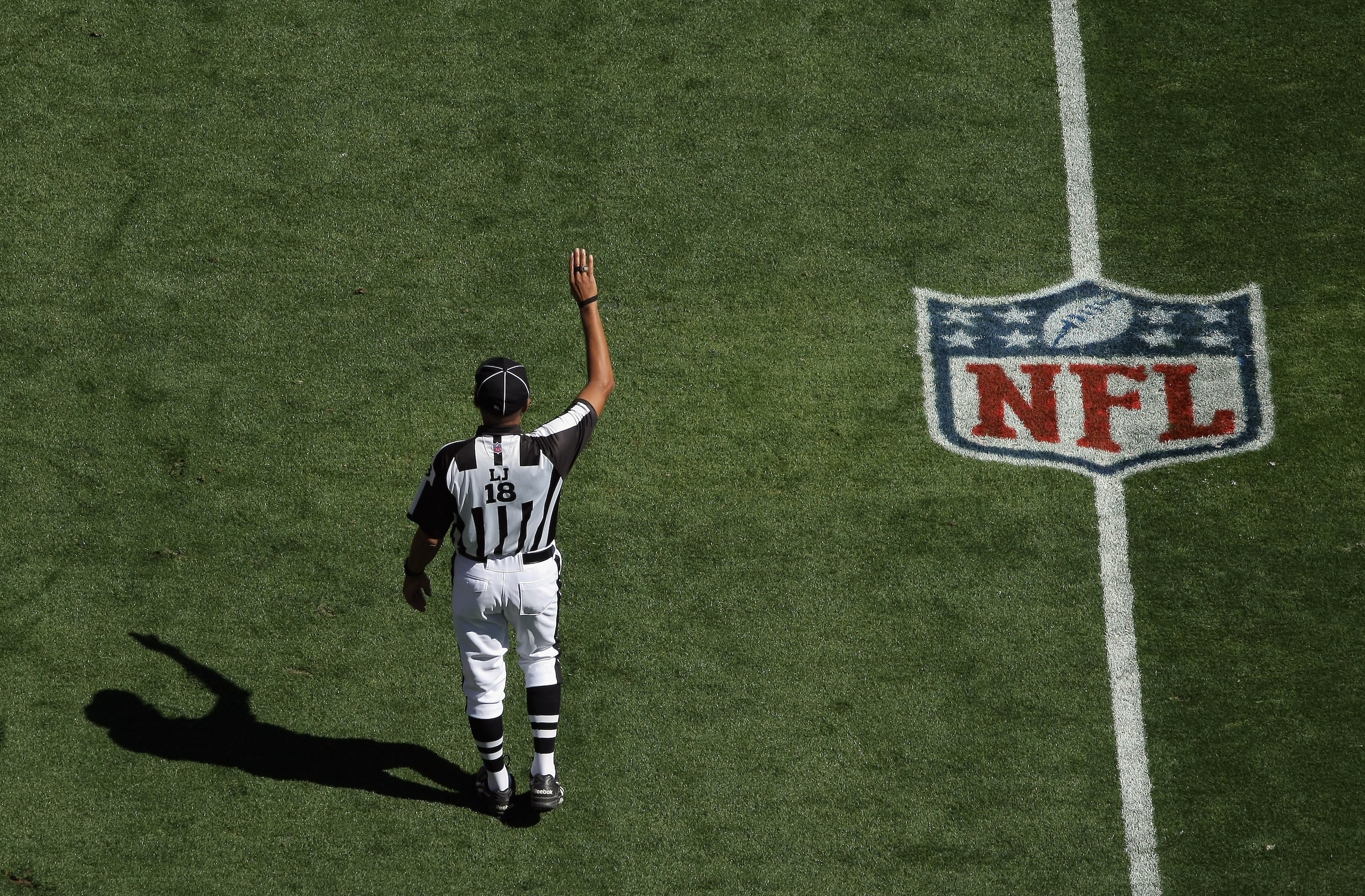 DENVER - SEPTEMBER 19:  Line judge Byron Boston oversees the action as the Seattle Seahawks face the Denver Broncos at INVESCO Field at Mile High on September 19, 2010 in Denver, Colorado The Broncos defeated the Seahawks 31-14..  (Photo by Doug Pensinger