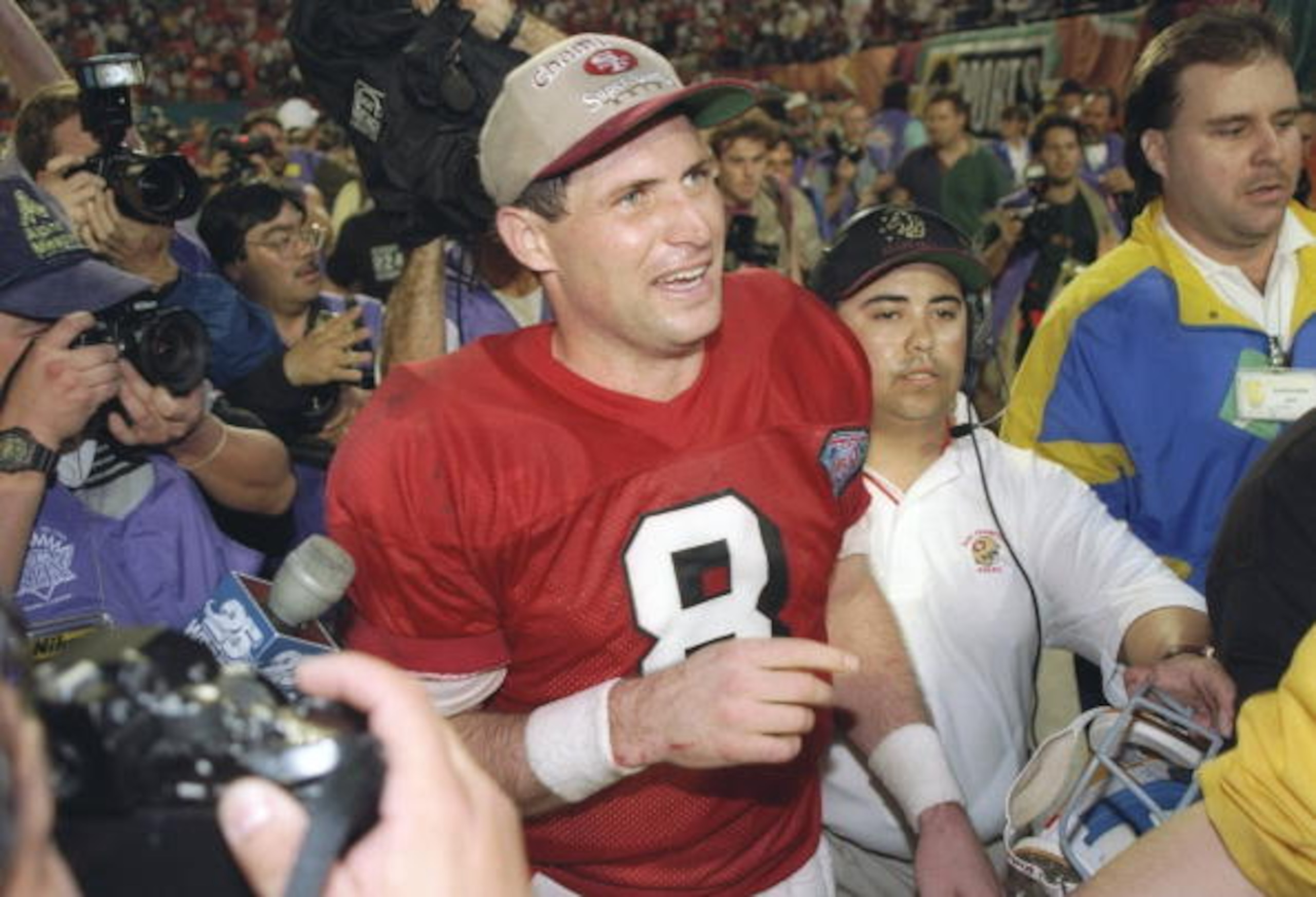 29 Jan 1995:   Quarterback Steve Young #8 of the San Francisco 49ers is cheered by the crowd after the 49ers defeated the San Diego Chargers at Super Bowl XXIX at the Joe Robbie Stadium in Miami, Florida.  Young was named MVP and the 49ers won 49-26.