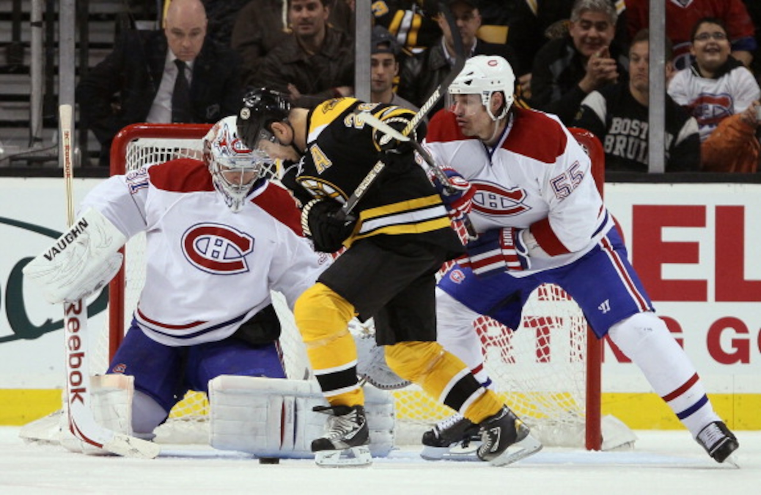 BOSTON, MA - MARCH 24:  Mark Recchi #28 of the Boston Bruins tries to take a shot as Brent Sopel #55 and Carey Price #31 of the Montreal Canadiens defend on March 24, 2011 at the TD Garden in Boston, Massachusetts.  (Photo by Elsa/Getty Images)