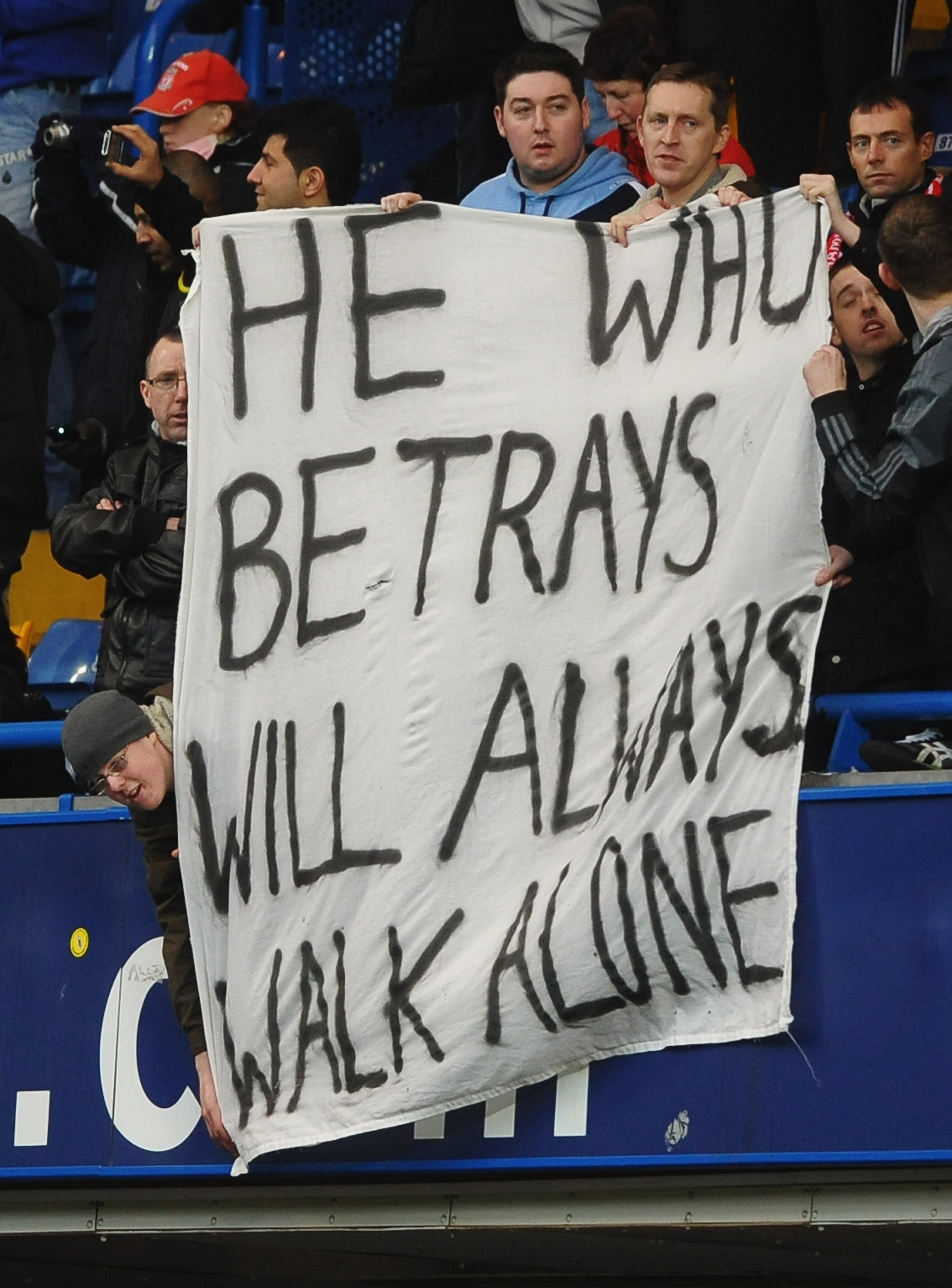 LONDON, ENGLAND - FEBRUARY 06:  Liverpool fans hold a banner showing their feelings towards Fernando Torres during the Barclays Premier League match between Chelsea and Liverpool at Stamford Bridge on February 6, 2011 in London, England.  (Photo by Lauren