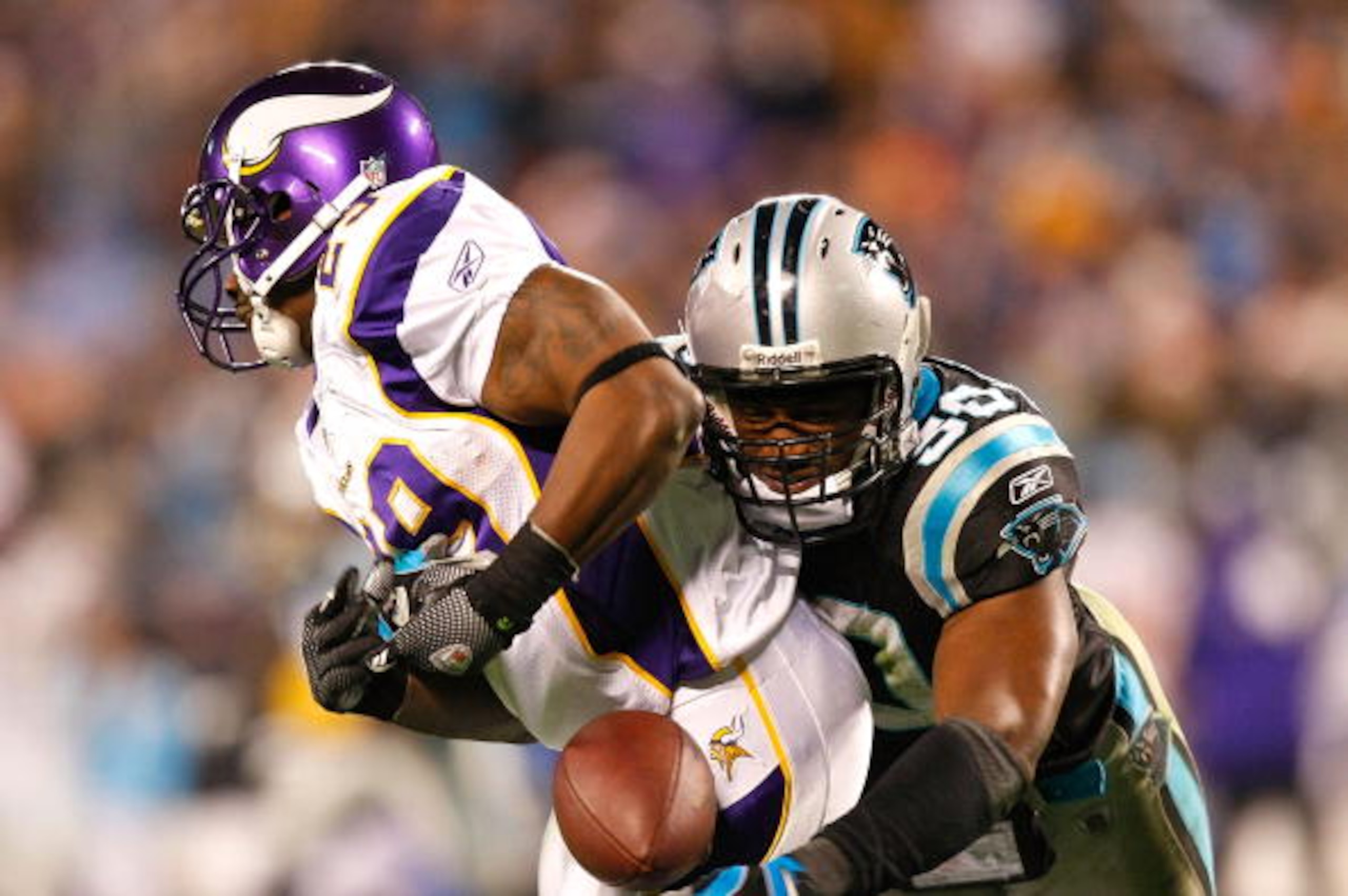 CHARLOTTE, NC - DECEMBER 20:  James Anderson #50 of the Carolina Panthers breaks up a reception by Chester Taylor #29 of the Minnesota Vikings at Bank of America Stadium on December 20, 2009 in Charlotte, North Carolina.  (Photo by Kevin C. Cox/Getty Imag