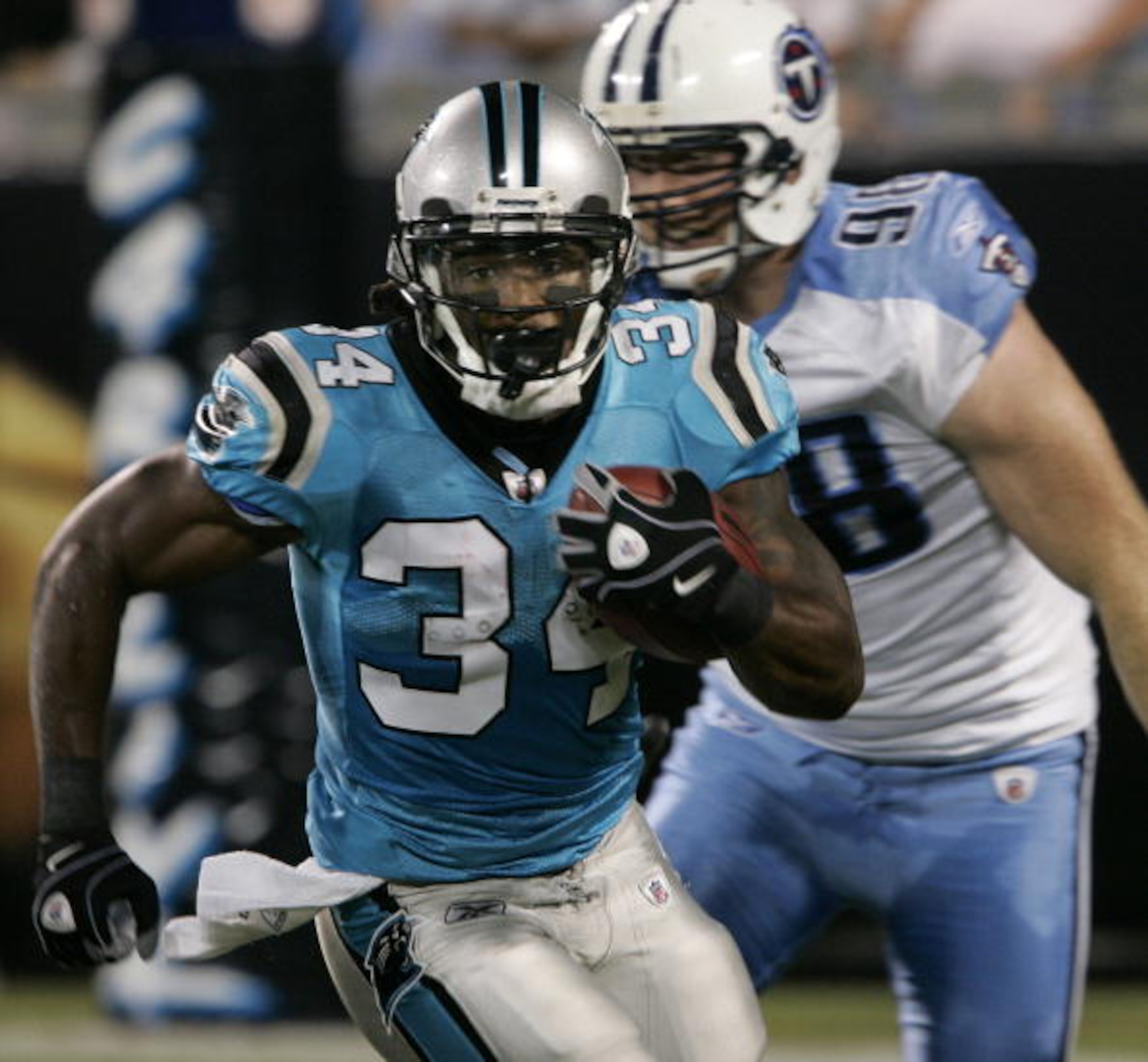CHARLOTTE, NC _ AUGUST 28: Running back DeAngelo Williams #34 of the Carolina Panthers rushes for yardage during their preseason game against the Tennessee Titans at Bank of America Stadium on August 28, 2010 in Charlotte, North Carolina. (Photo by Mary A