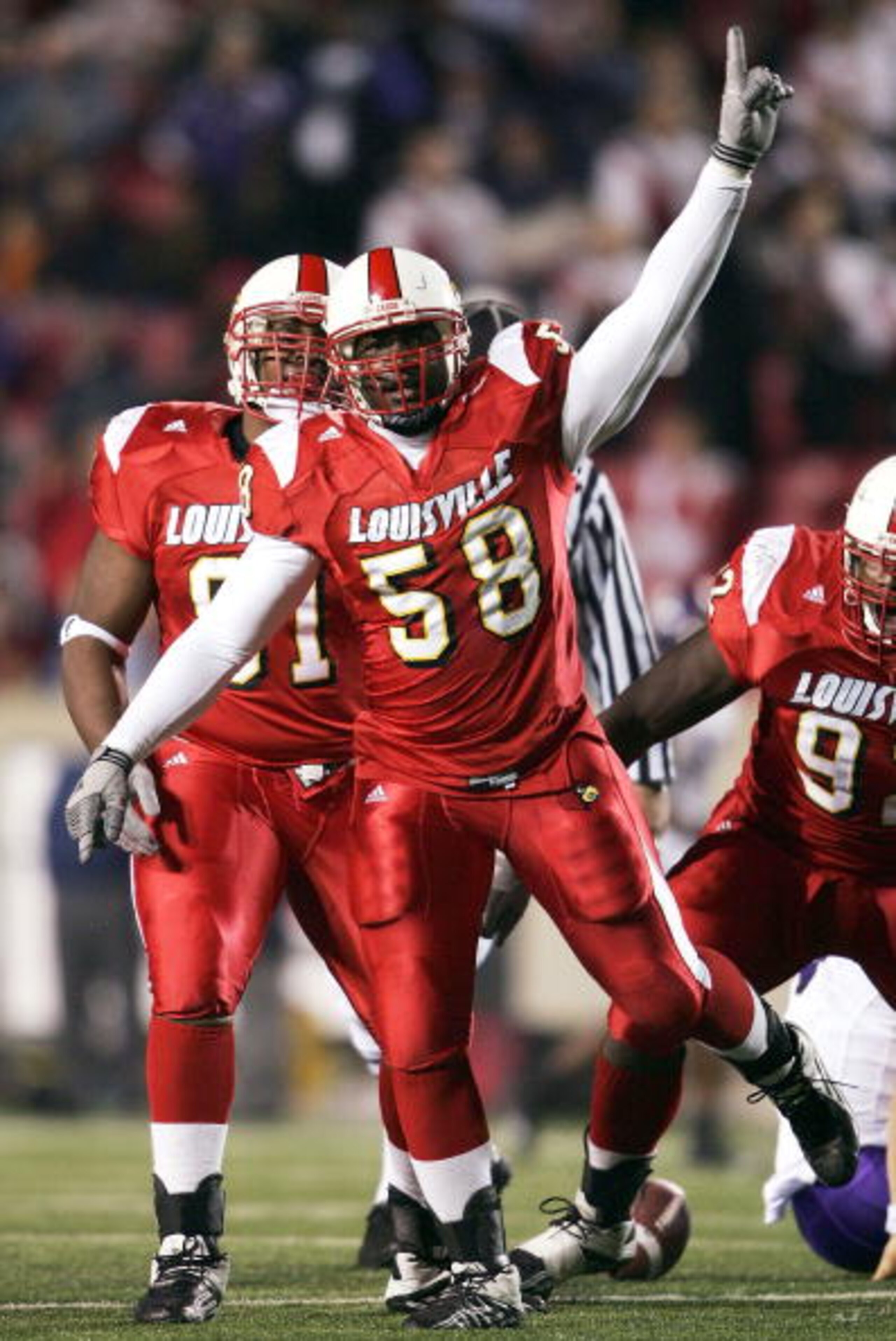 LOUISVILLE, KY - NOVEMBER 10:  Defensive end Elvis Dumervil #58 of Louisville celebrates a sack against TCU at Papa John's Cardinals Stadium on November 10, 2004 in Louisville, Kentucky.  (Photo by Andy Lyons/Getty Images)