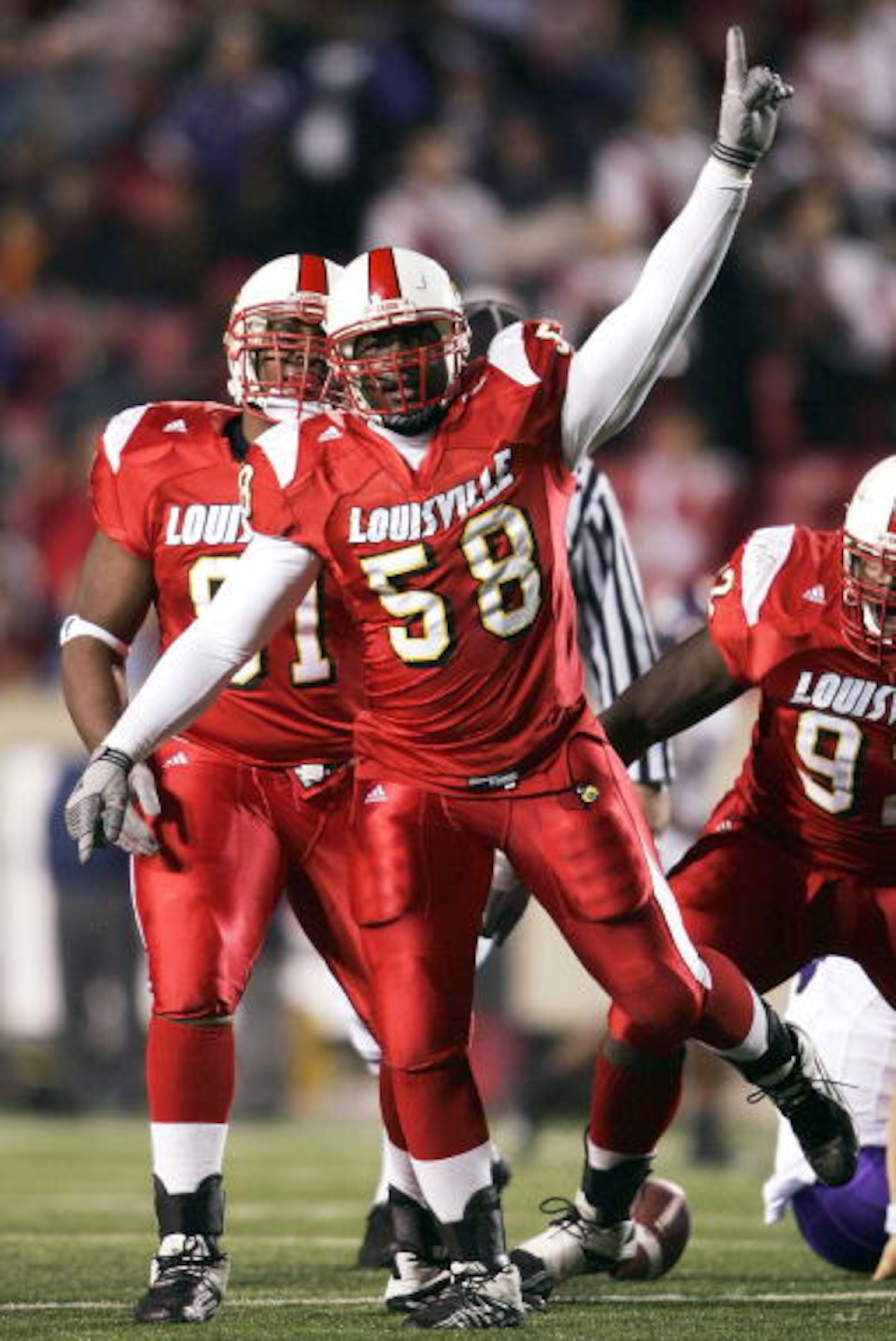 LOUISVILLE, KY - NOVEMBER 10: Defensive end Elvis Dumervil #58 of Louisville celebrates a sack against TCU at Papa John's Cardinals Stadium on November 10, 2004 in Louisville, Kentucky. (Photo by Andy Lyons/Getty Images) LOUISVILLE, KY - NOVEMBER 10: Defensive end Elvis Dumervil #58 of Louisville celebrates a sack against TCU at Papa John's Cardinals Stadium on November 10, 2004 in Louisville, Kentucky. (Photo by Andy Lyons/Getty Images)