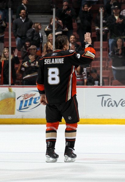 ANAHEIM, CA - APRIL 08:  Teemu Selanne #8 of the Anaheim Ducks waves as he skates after being named first star of the game against the Los Angeles King at Honda Center on April 8, 2011 in Anaheim, California. The Ducks won 2-1 to clinch a berth in the pla