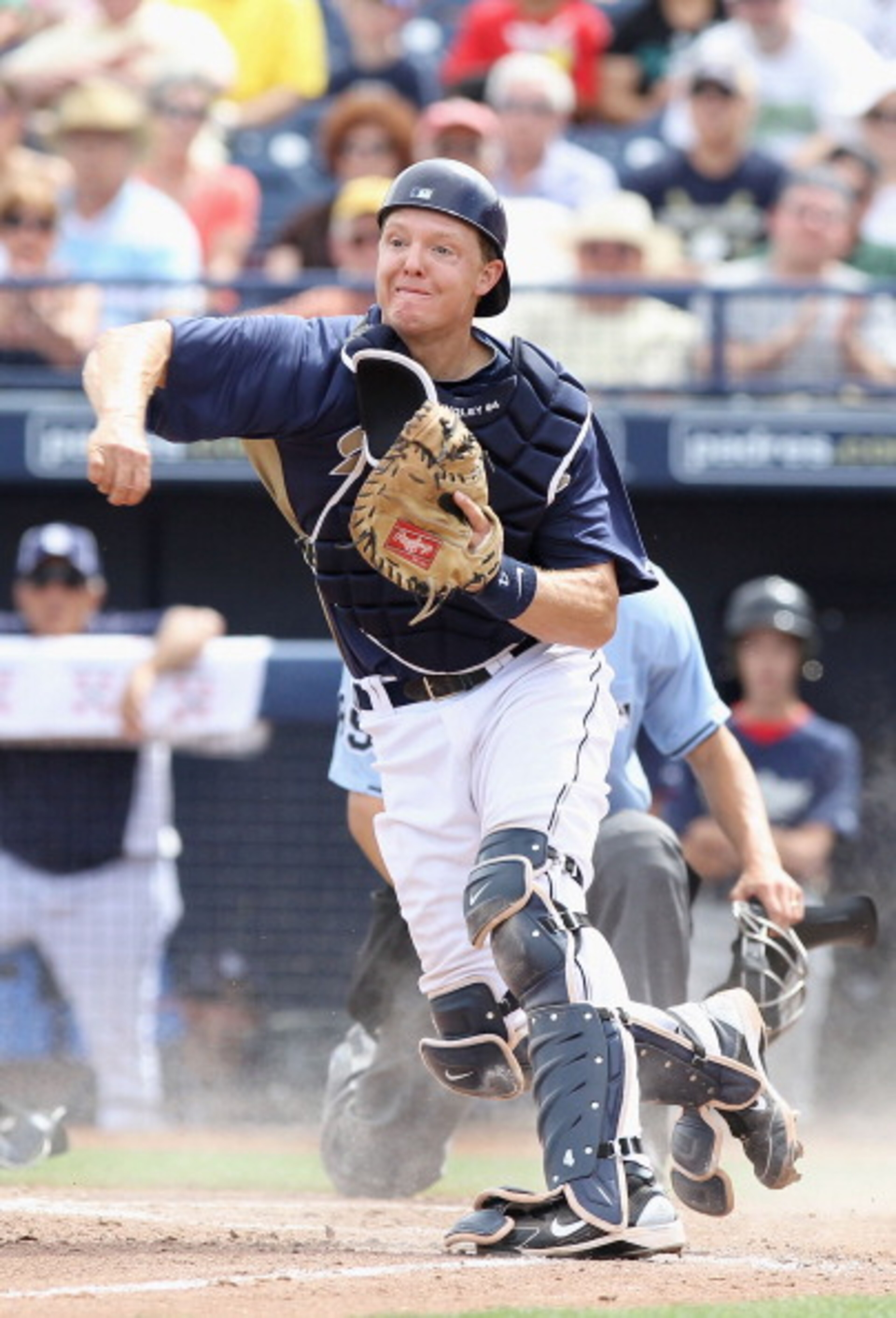 PEORIA, AZ - MARCH 15:  Catcher Nick Hundley #4 of the San Diego Padres throws to third base against the Los Angeles Angels of Anaheim during the spring training game at Peoria Stadium on March 15, 2011 in Peoria, Arizona.  (Photo by Christian Petersen/Ge