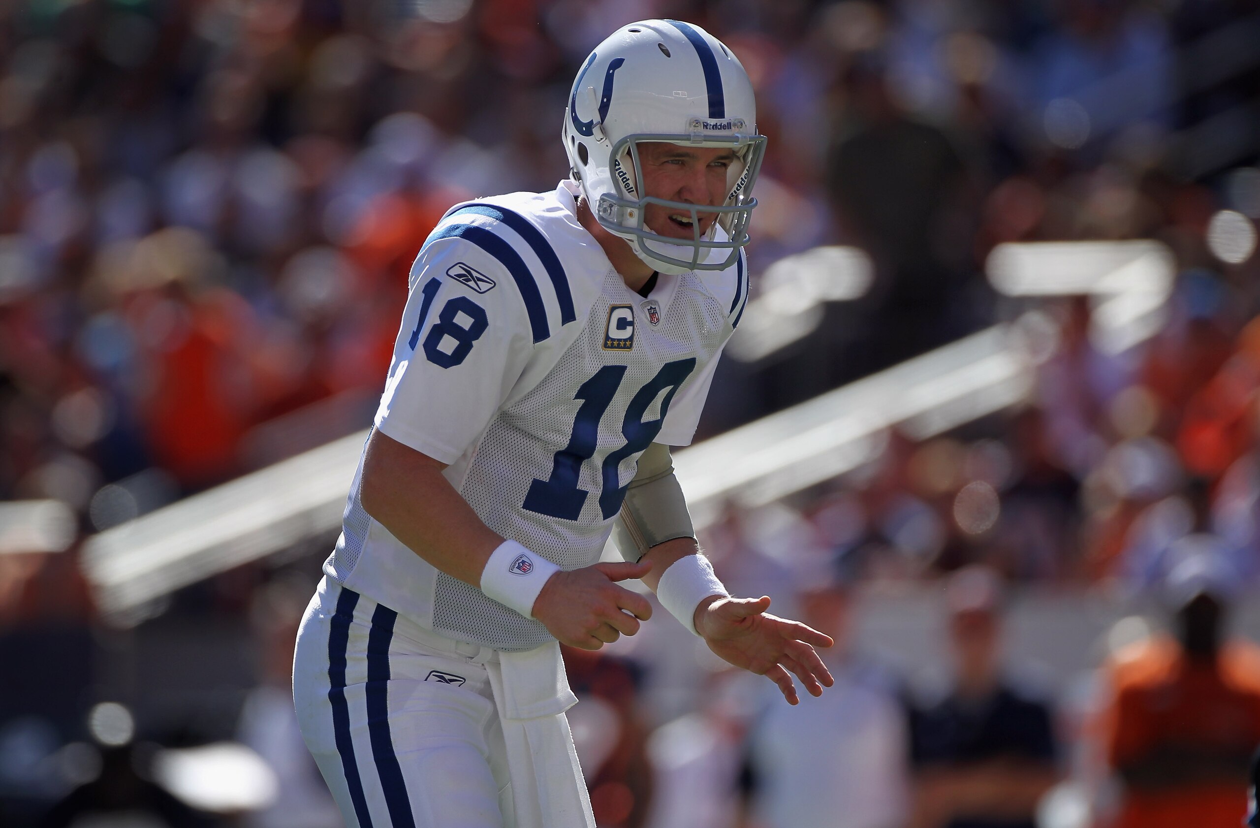 DENVER - SEPTEMBER 26: Quarterback Peyton Manning #18 of the Indianapolis Colts directs the offense against the Denver Broncos at INVESCO Field at Mile High on September 26, 2010 in Denver, Colorado. The Colts defeated the Broncos 27-13. (Photo by Doug DENVER - SEPTEMBER 26: Quarterback Peyton Manning #18 of the Indianapolis Colts directs the offense against the Denver Broncos at INVESCO Field at Mile High on September 26, 2010 in Denver, Colorado. The Colts defeated the Broncos 27-13. (Photo by Doug