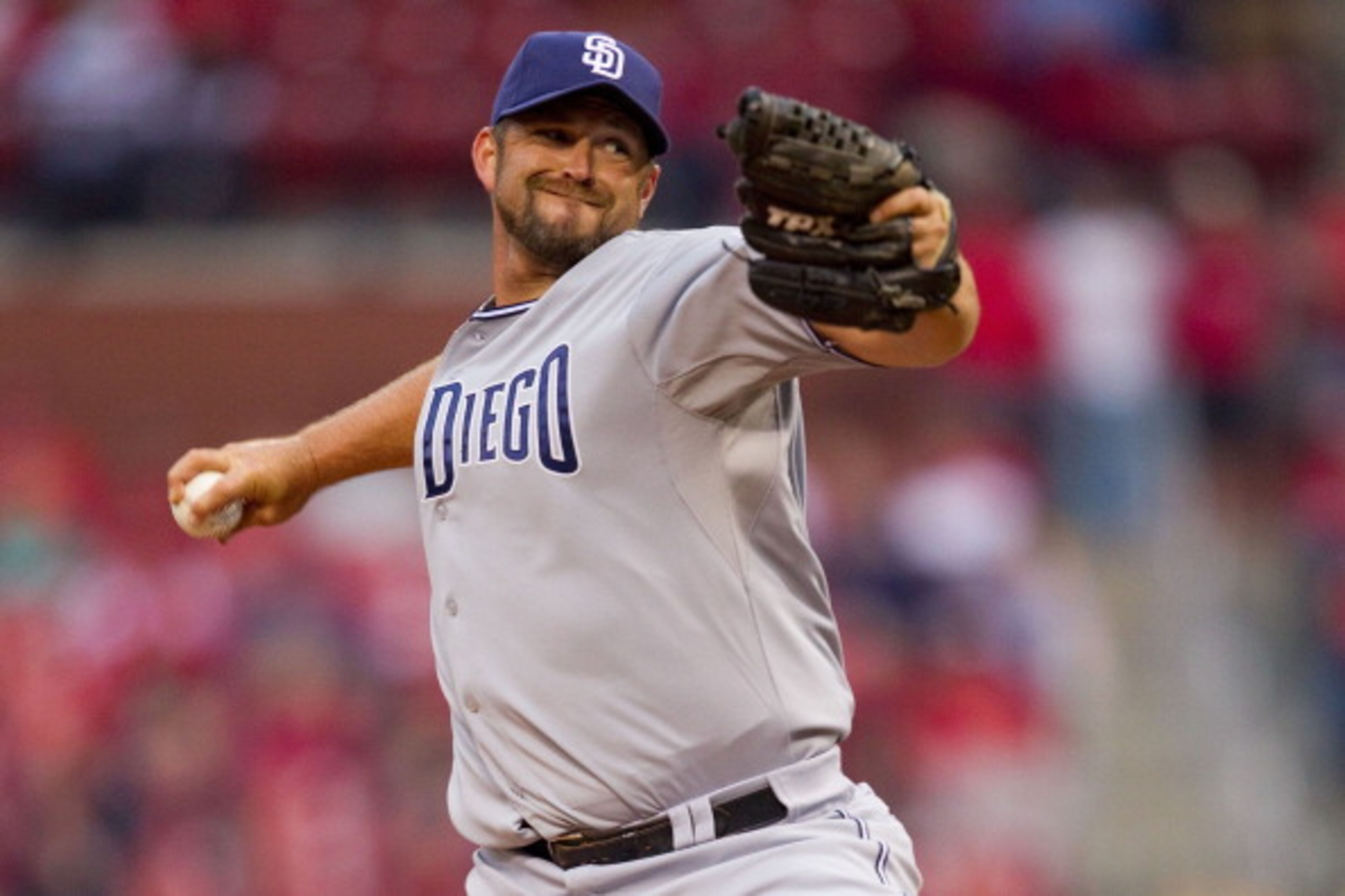 ST. LOUIS, MO - MARCH 31: Reliever Heath Bell #21 of the San Diego Padres pitches against the St. Louis Cardinals on opening day at Busch Stadium on March 31, 2011 in St. Louis, Missouri.  (Photo by Dilip Vishwanat/Getty Images)